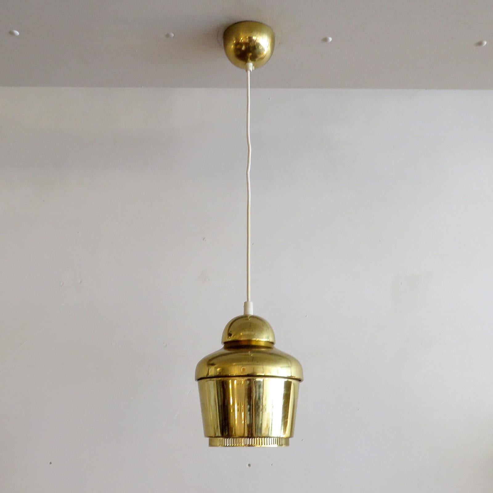 Wonderful 'Golden Bell' pendant light Model A330, designed by Alvar Aalto in 1954, an intricate version with two rings for emitting warm ambient light, first used in the teachers' canteen 'Lyhty', at the University of Jyväskylä, wired for US