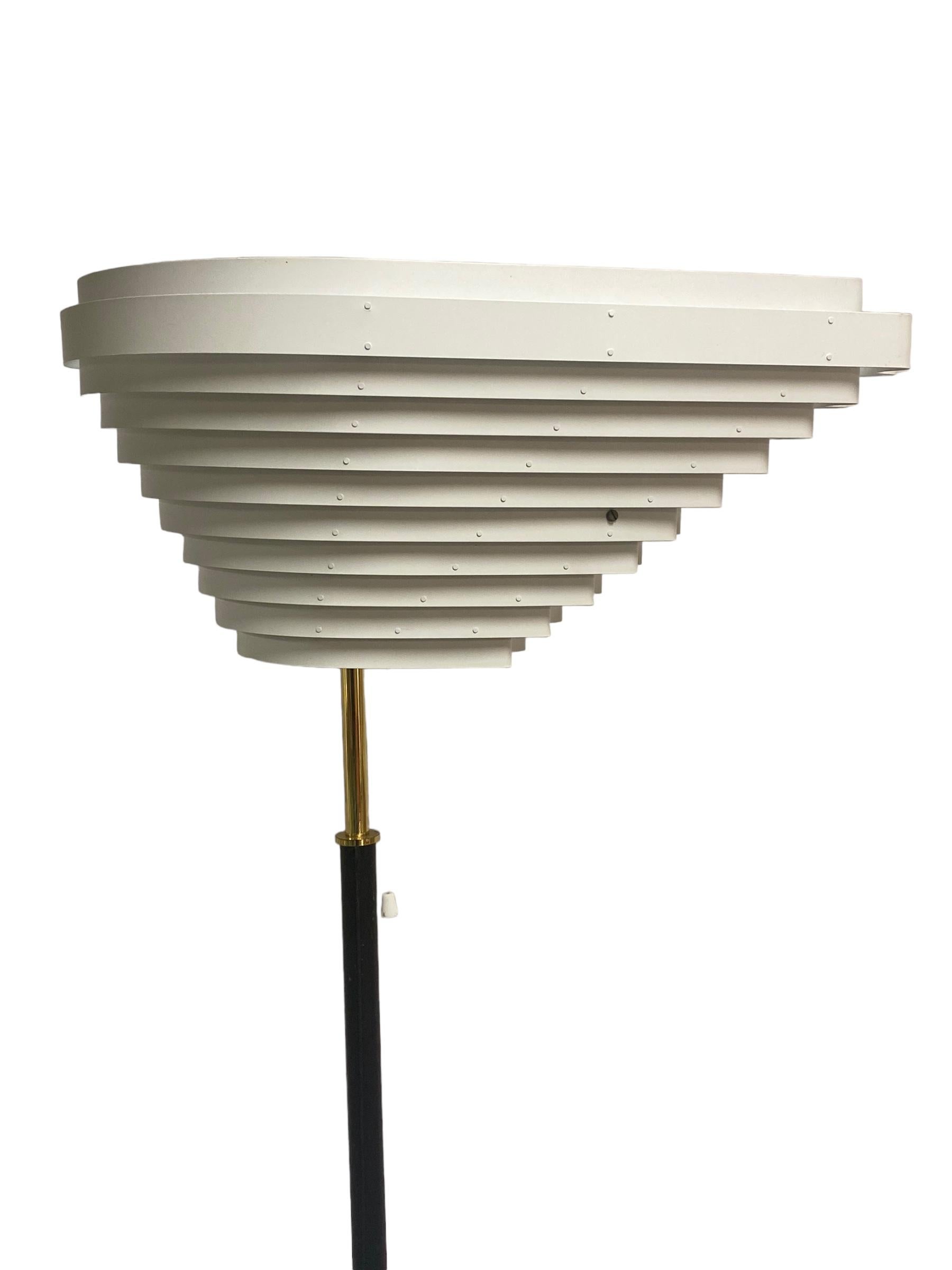 This lamp is a legendary Alvar Aalto design and one of his finest creations.

It was first designed in 1954 for the Social Insurance Institution of Finland.

The name of course comes from the shape of the shade which is asymmetrical and looks like