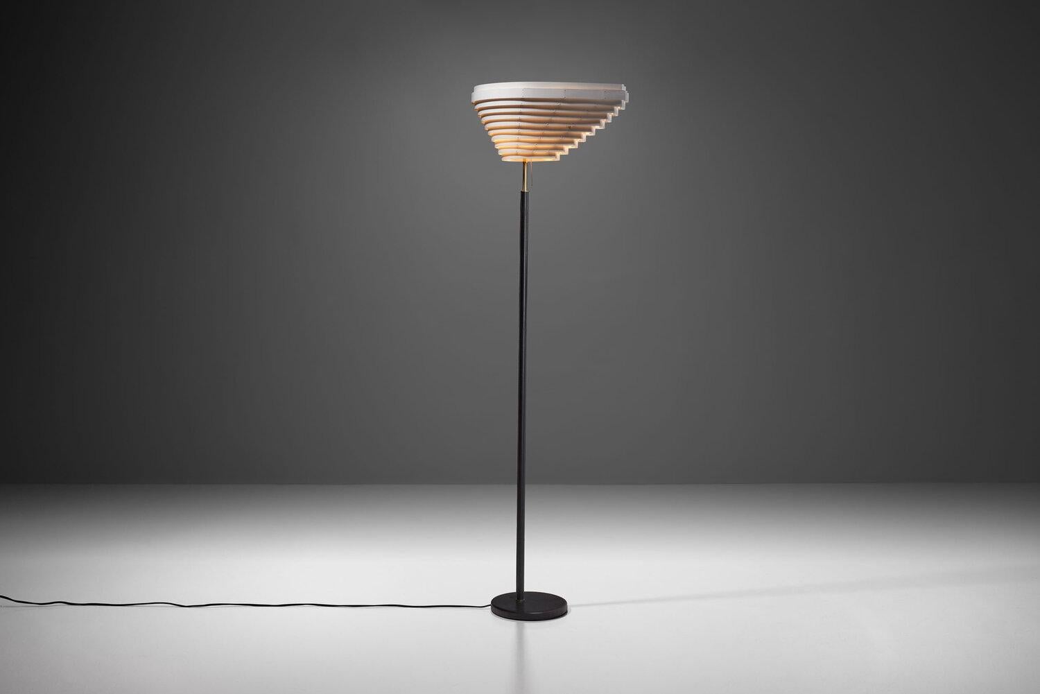 Originally designed by Alvar Aalto for the National Pensions Institute in Helsinki in 1954, the A805 model, better known as the “Angel Wing” floor lamp, is a true modern icon. 

The A805's asymmetrical louvered shade is reminiscent of wings, which