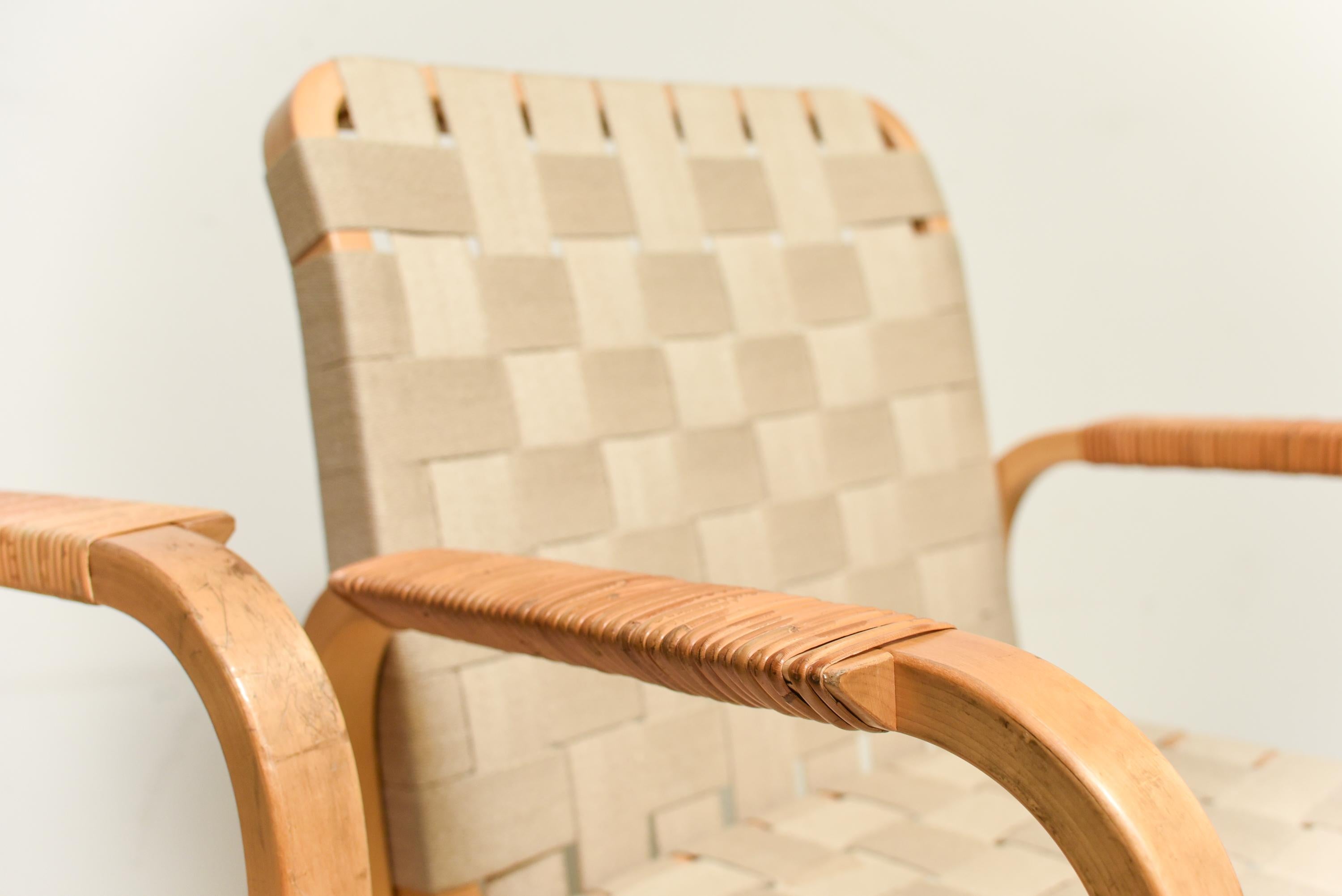 Mid Century Alvar Aalto birtch and linen rattan wrapped arms chairs, 1947.