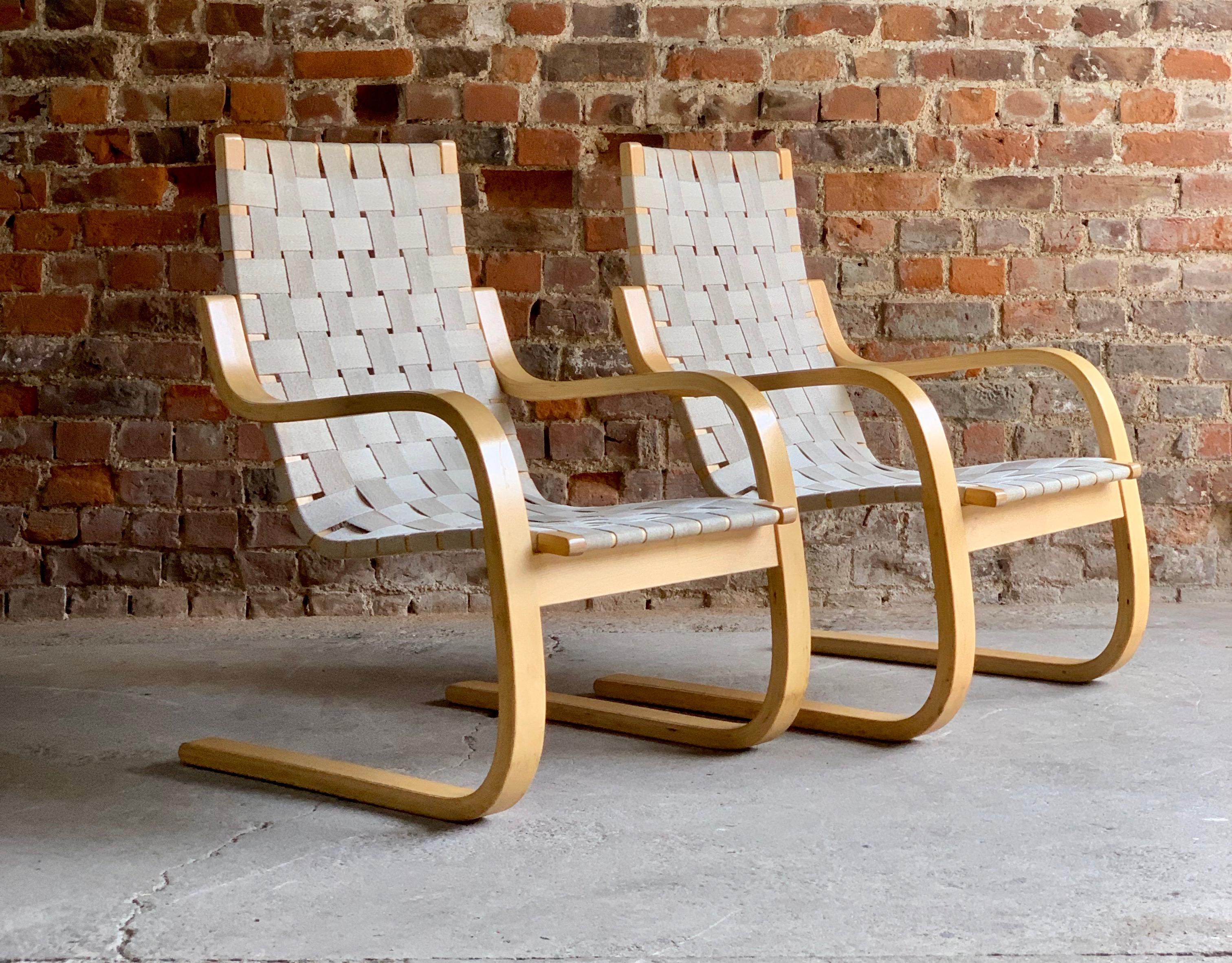 Alvar Aalto armchair model 406 pair of Cantilever chairs by Artek, circa 1970s

Magnificent early Alvar Aalto model 406 Cantilever lounge chairs by Artek circa 1970s, natural bentwood laminated Birch frames with woven canvas strapped