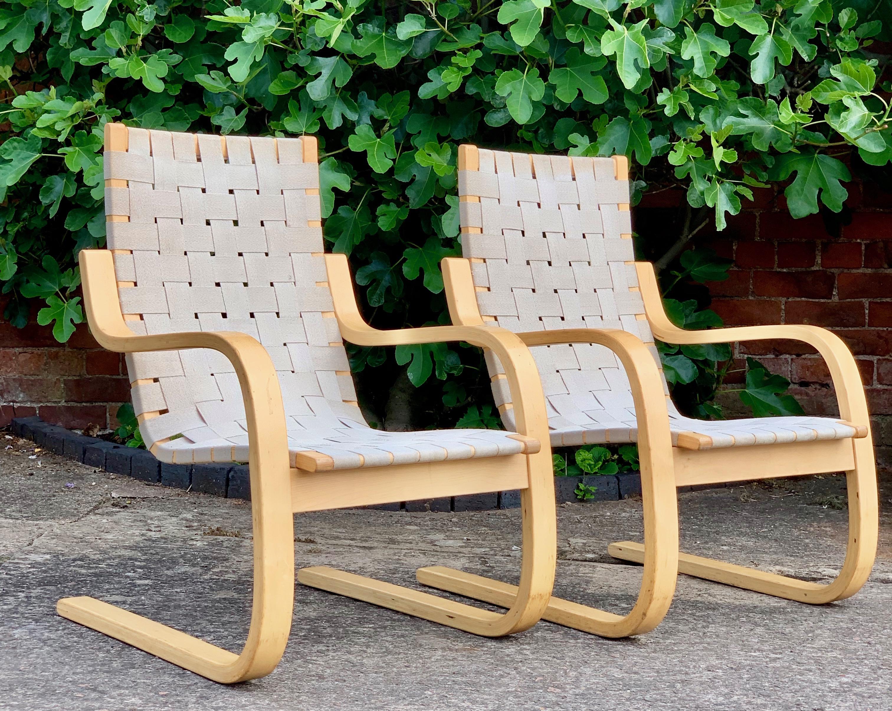 Alvar Aalto armchair model 406 pair of cantilever chairs by Artek, circa 1970s

Magnificent early Alvar Aalto model 406 Cantilever lounge chairs by Artek circa 1970s, natural bentwood laminated Birch frames with woven canvas strapped