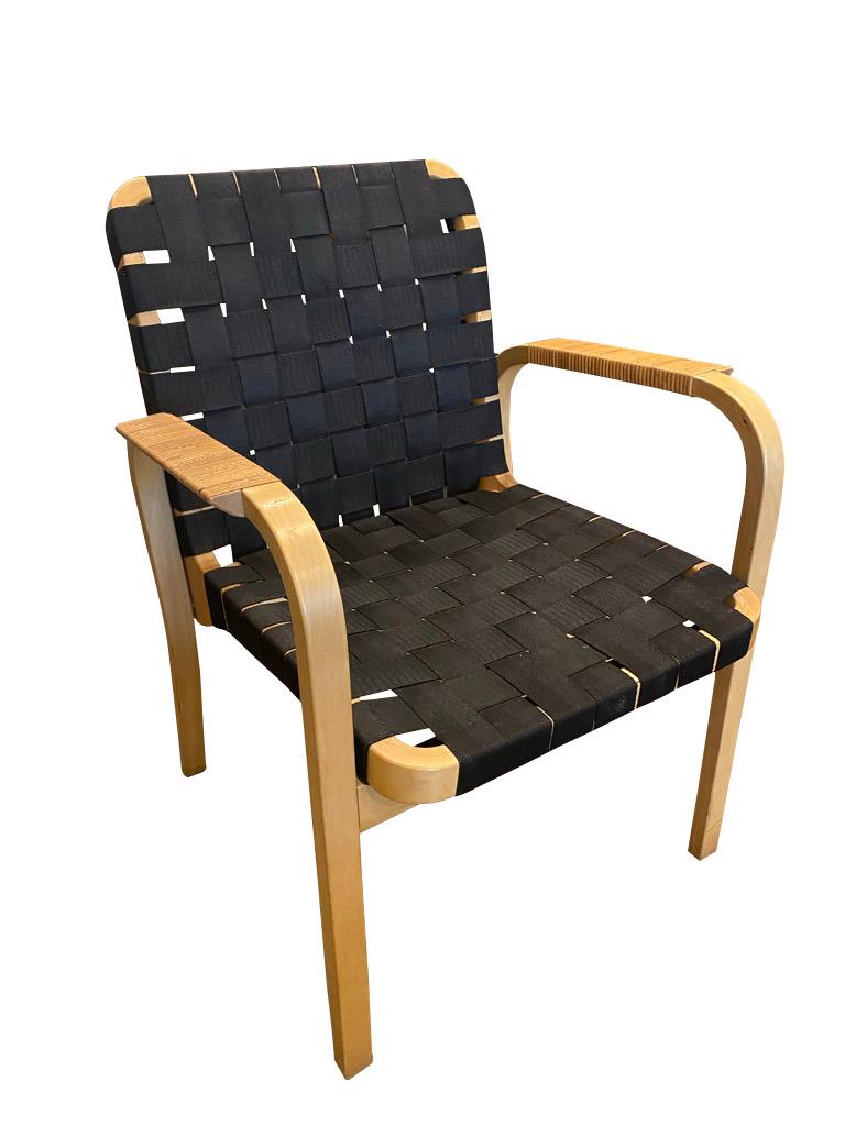 Model 45 armchairs, designed in 1947 by Alvar Aalto and manufactured later by Artek. Beech frames and woven black nylon seat and back make a comfortable and sought after combination that is iconic to Scandinavian modern design. Original condition.