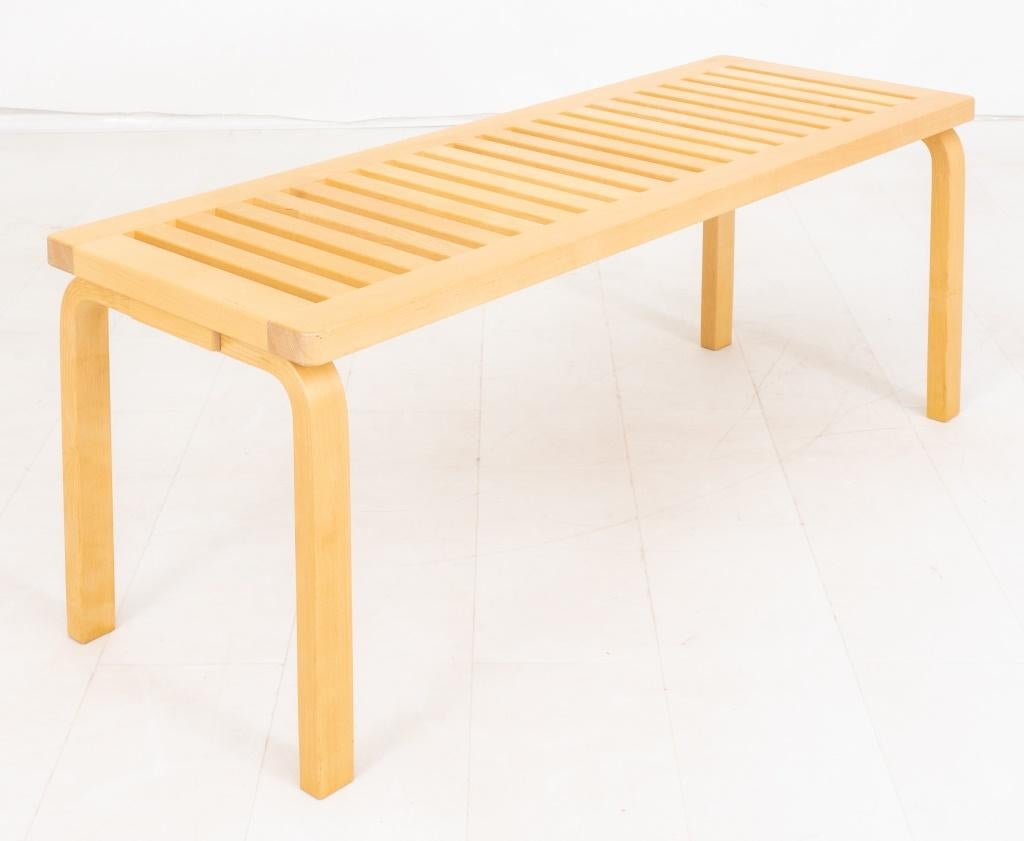 Alvar Aalto (Finnish, 1898 - 1976) for Artek Mid-Century Modern 153 bench with natural wood top and legs, made in 2014, marked on bottom.

Dimensions: 17.25