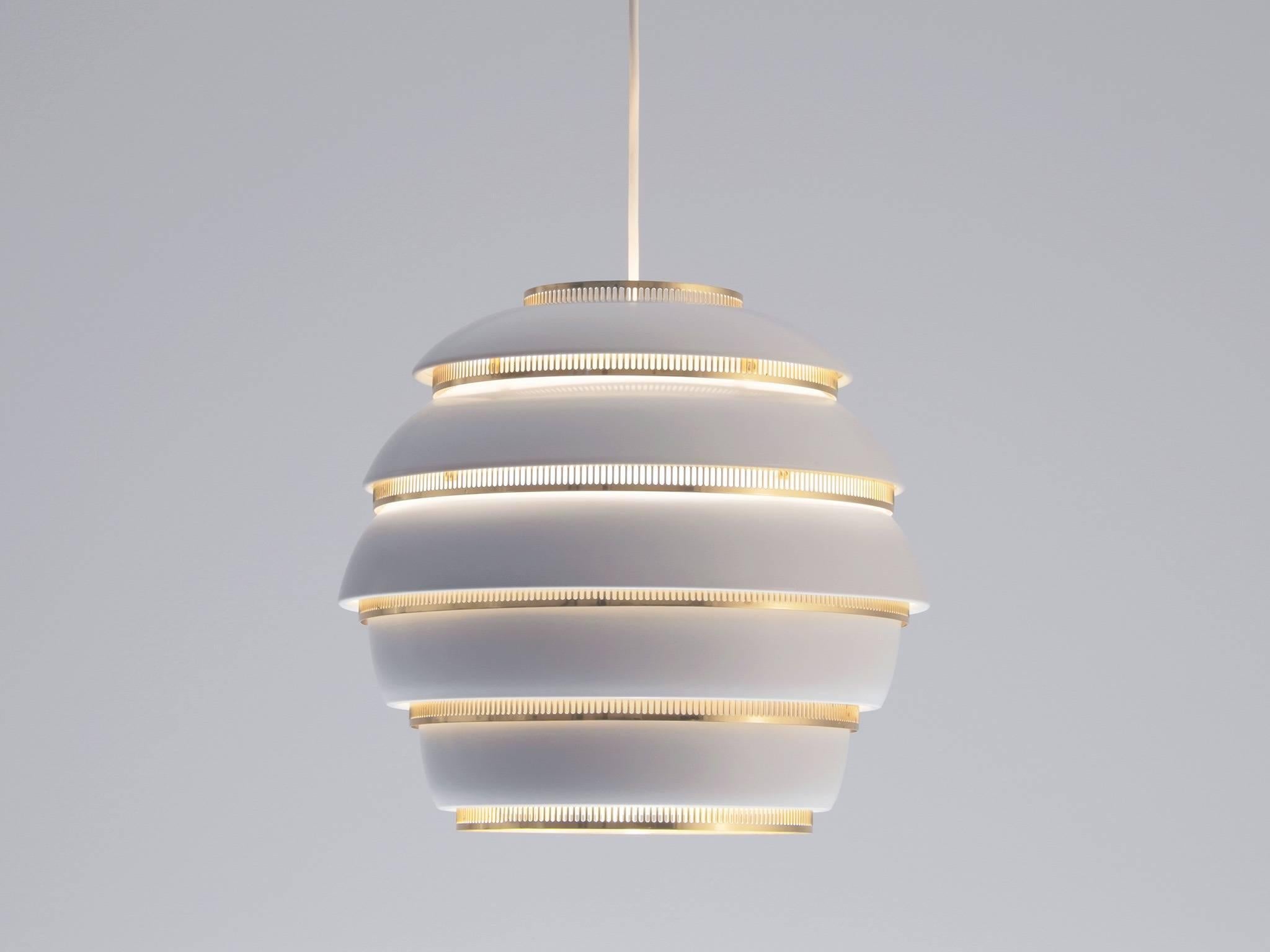 Alvar Aalto, A331 'Beehive' ceiling lamp by Valaisinpaja Oy, Finland, 1950s. 

This Classic beehive shaped sphere has a very elegant and soft lighting and is very nicely finished with brass accents. This pendant has the shape of a 'beehive' and is