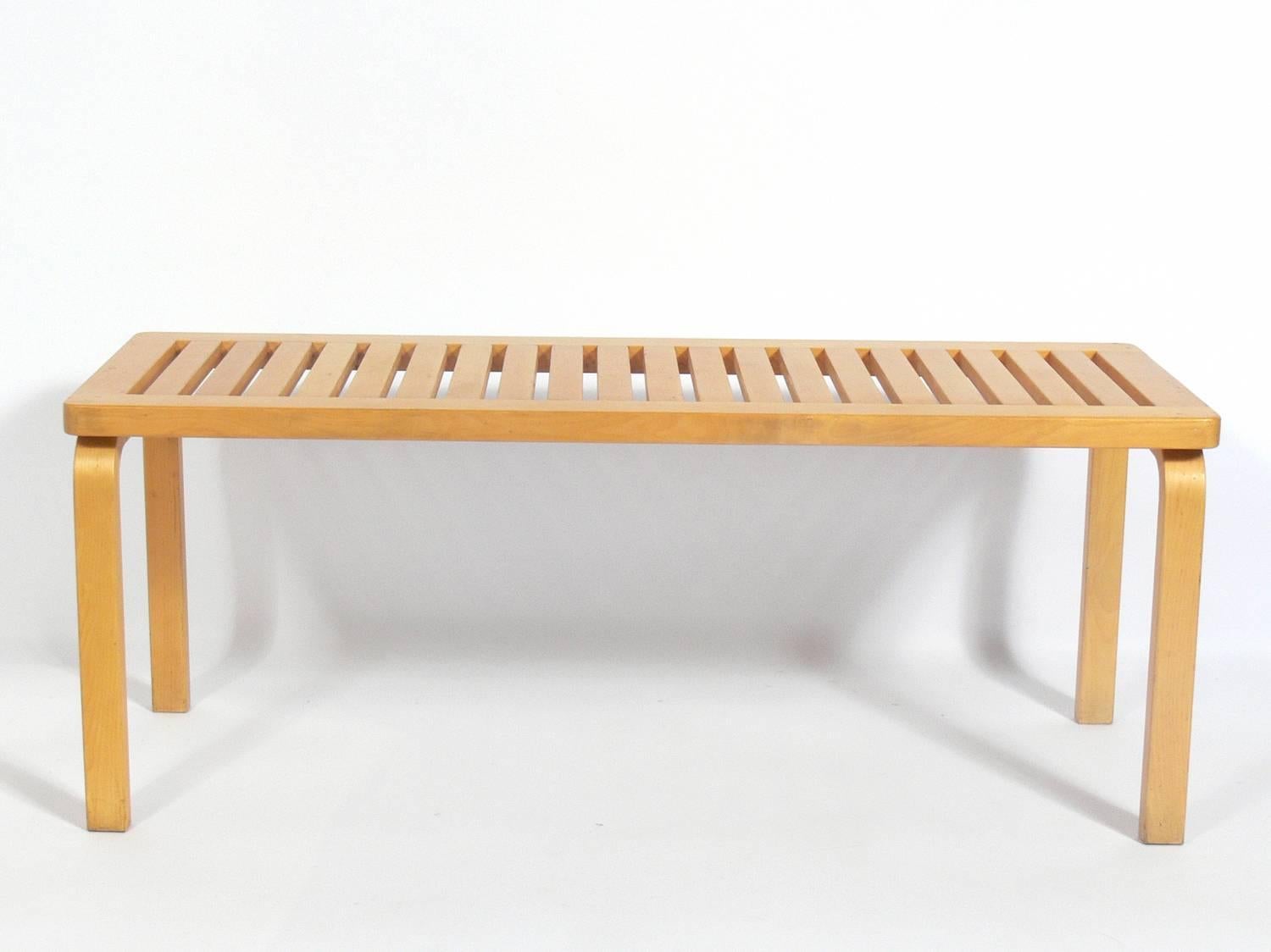 Alvar Aalto bench, originally designed circa 1930s, this is an authorized re-edition by ICF, circa 1980s. Signed underneath. Retains warm original patina. It is a versatile size and can be used as a bench or coffee table.