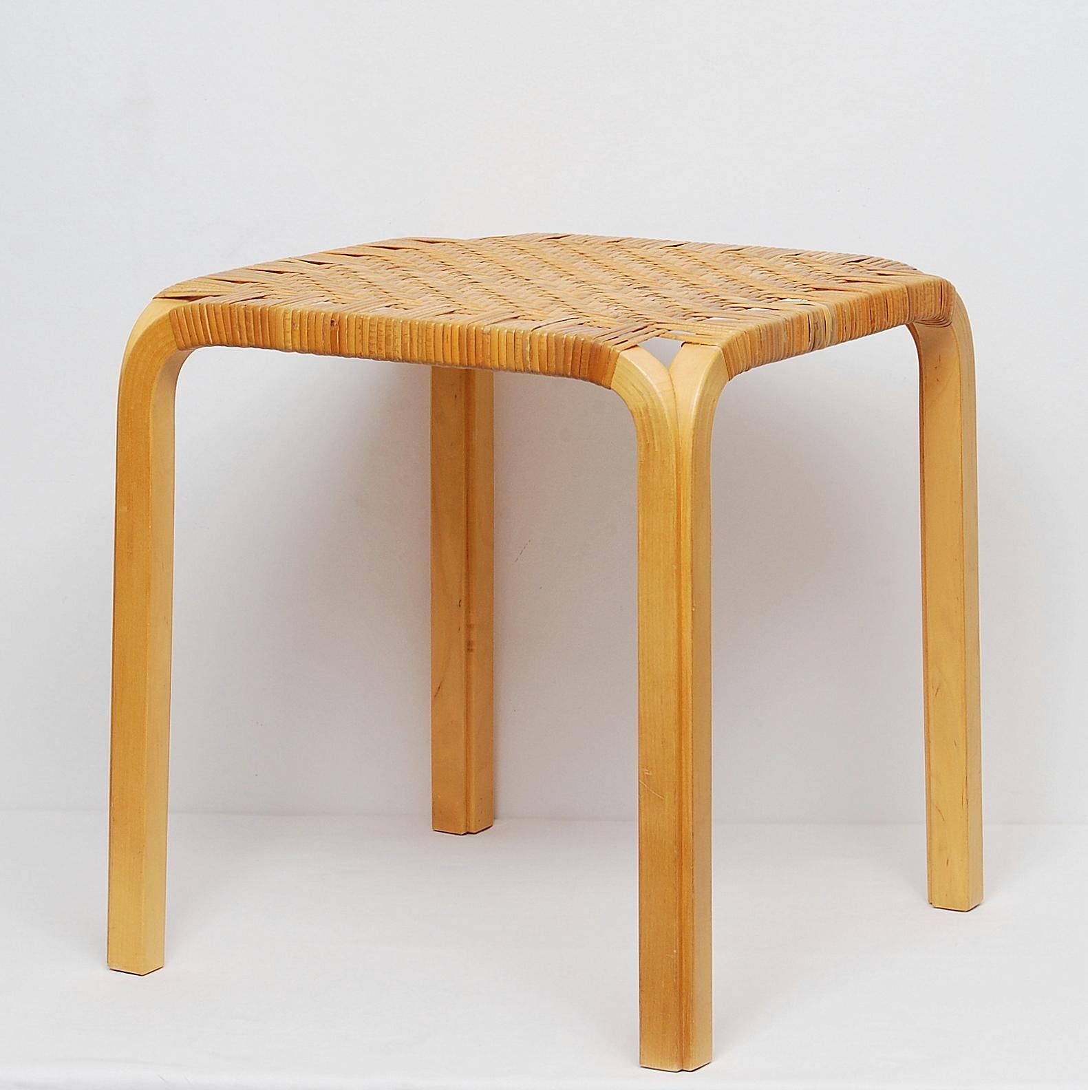 Alvar Aalto's Y61 stool, designed in 1947 with the unique Y-leg in birch and original cane webbing. Manufactured by Artek.
  