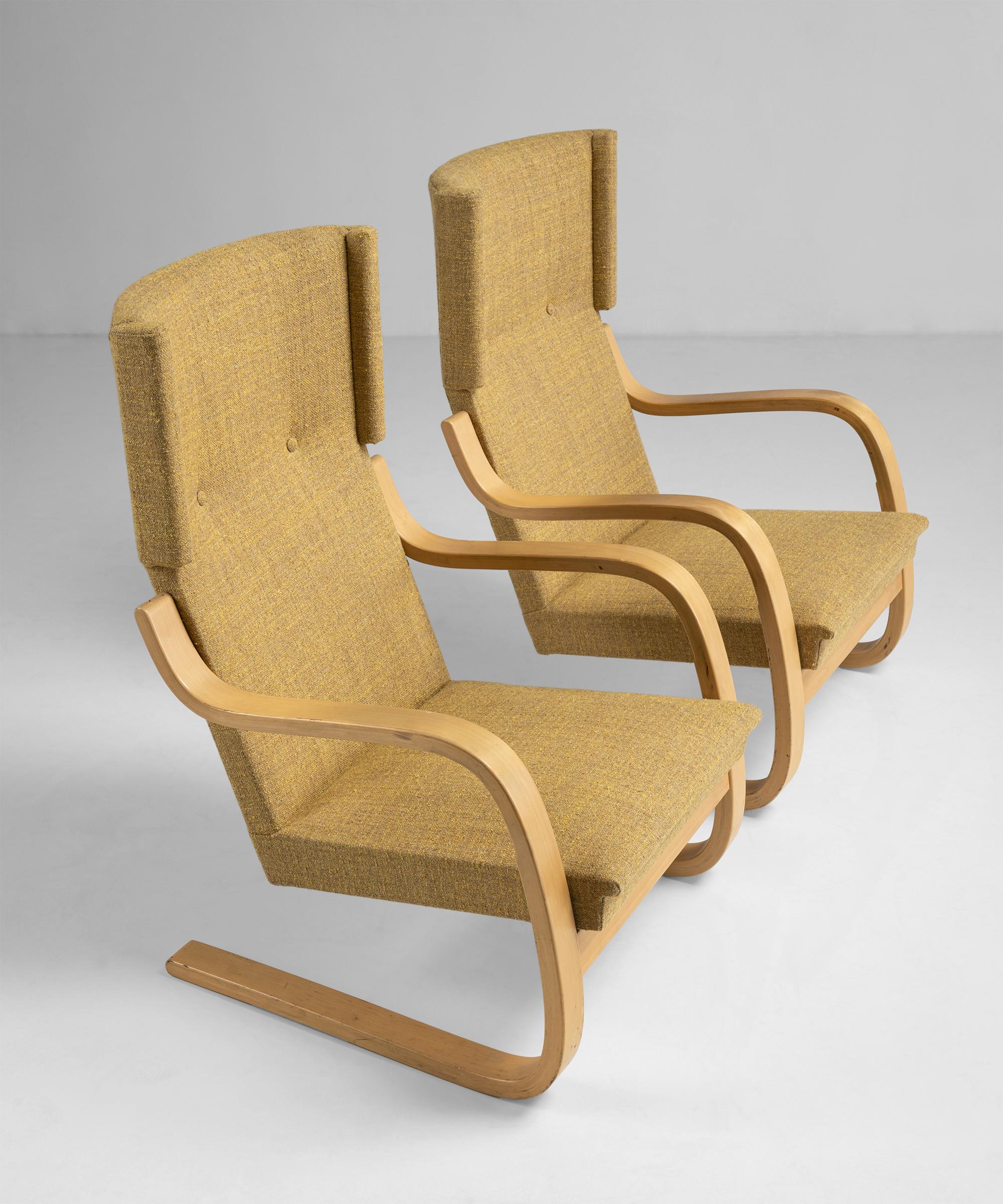 Alvar Aalto Cantilevered armchairs 

Finland Circa 1930

A pre-Artek 401 padded armchair, designed by Alvar Aalto for the Paimio Sanatorium. Newly upholstered in Textured Nub Golden Honey Tweed.

Measures: 25”W x 28”D x 38.5”H x 14” seat.