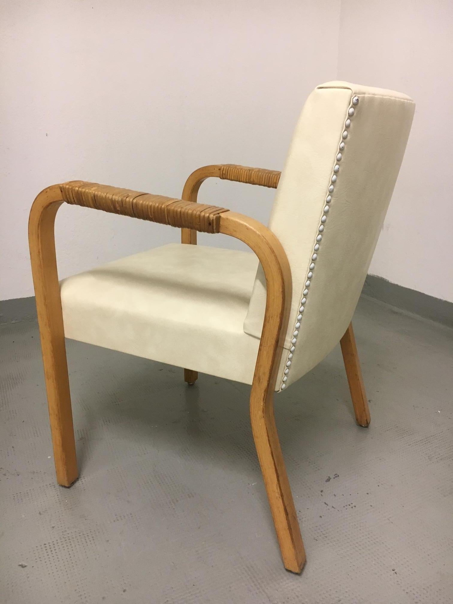 Alvar Aalto chair model 45, beech and vinyl upholstery, rattan on arms
Good vintage condition.
