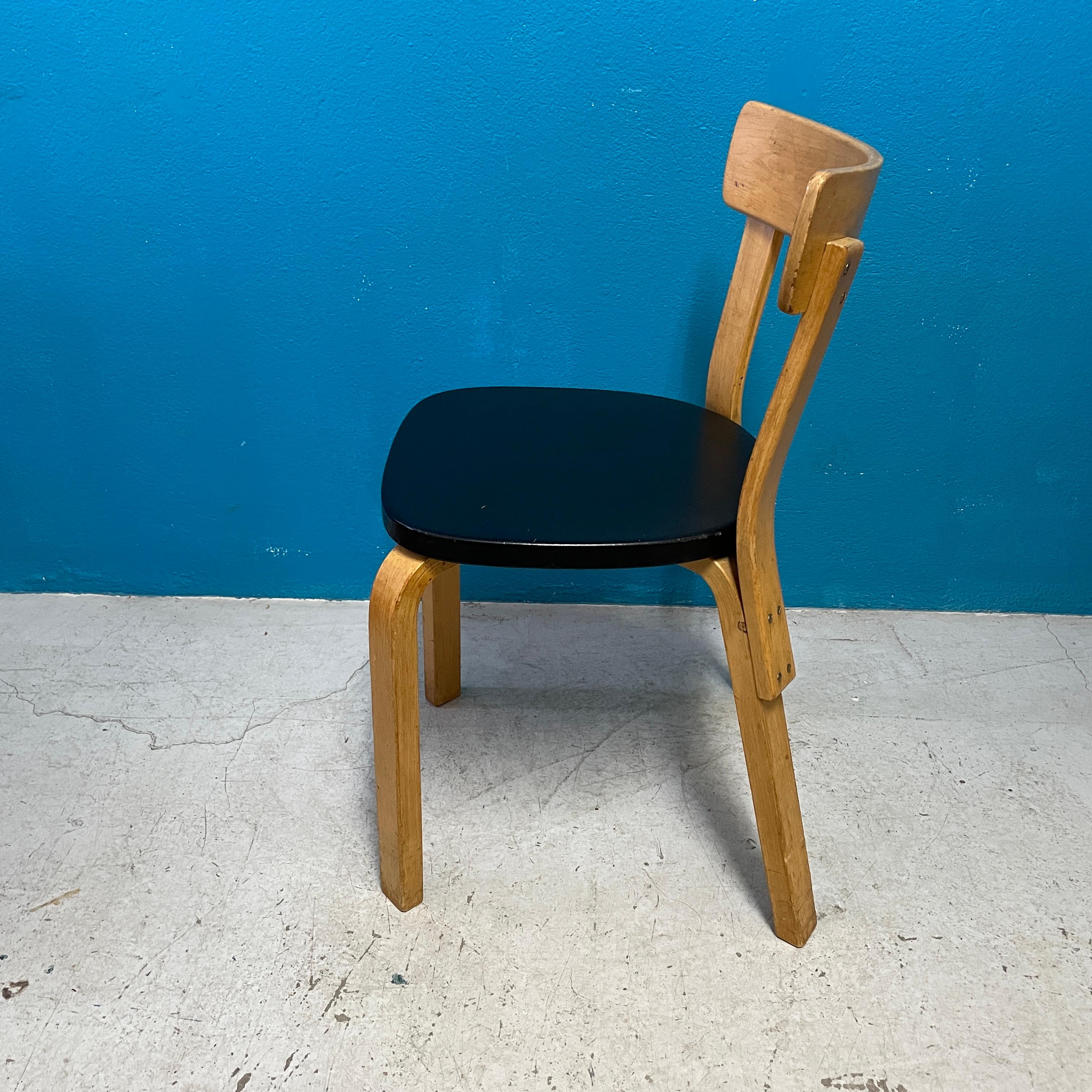 Artek's chair 69 was designed by Alvar Aalto in 1935. he chair uses Aalto’s iconic L-leg structure, which allows the legs to be attached directly to the seat. As one of Aalto’s best-known dining chairs, Chair 69 easily suits any room of the