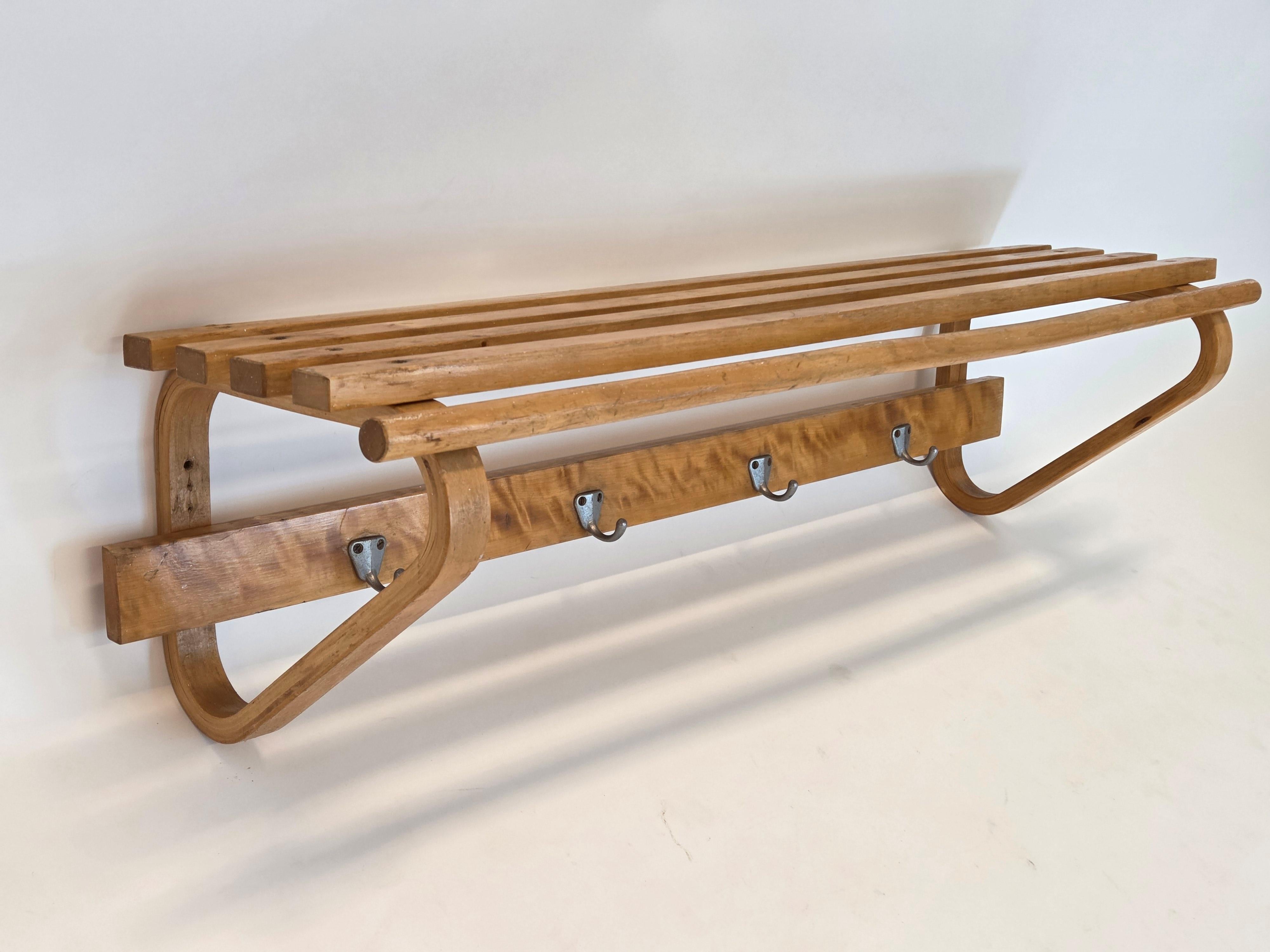 Artek coat rack, designed by Alvar Aalto. The coat rack is from around the 1960s, and it has a wonderful patina. The coat rack has also flamed birch on it, which makes this piece quite unique and rare.