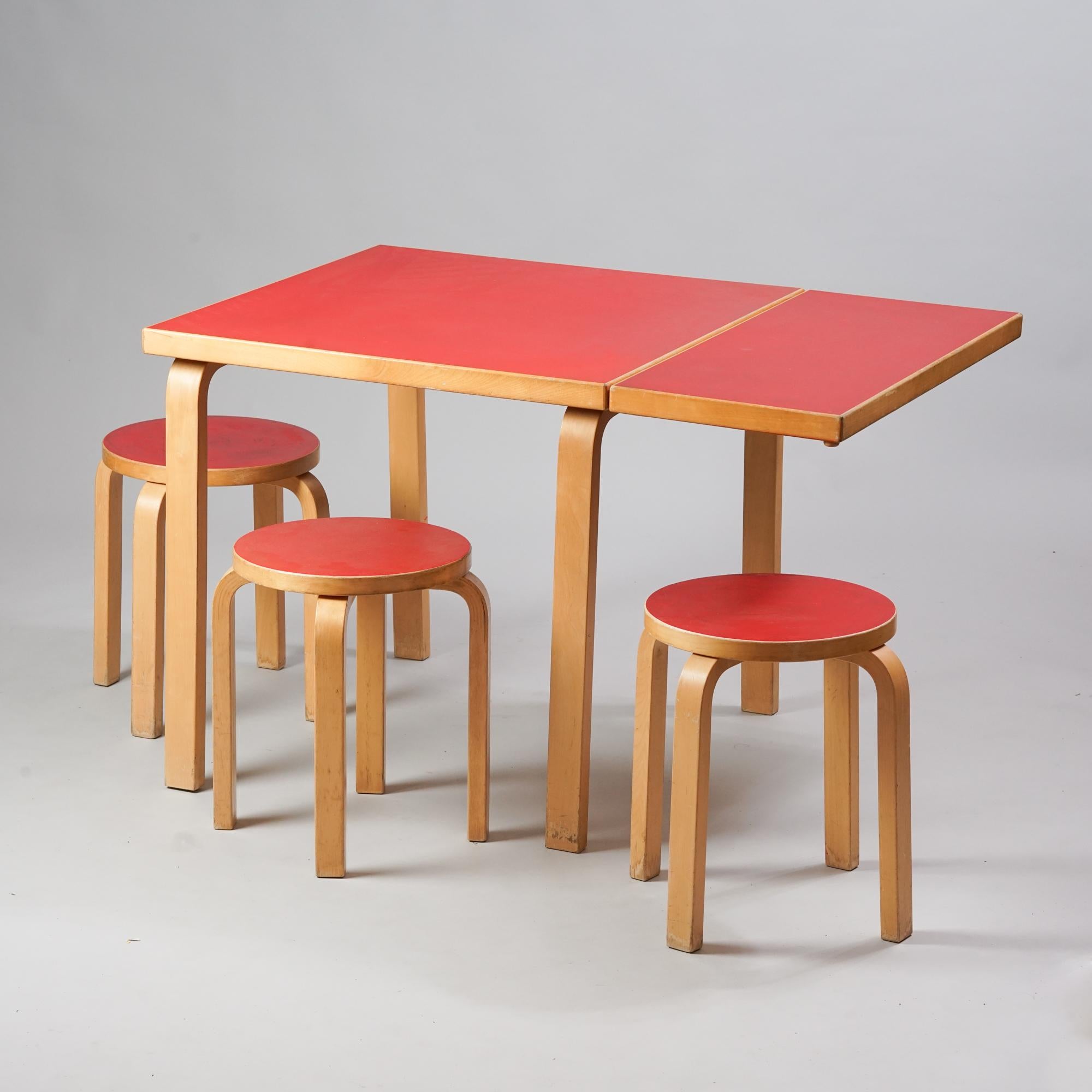 Alvar Aalto Dining Room Set, manufactured by Oy Huonekalu - ja Rakennustyötehdas Ab, 1950s. The set consists of extendable table and three model E60 stools. Birch with linoleum tops. Good vintage condition, patina and wear consistent with age and