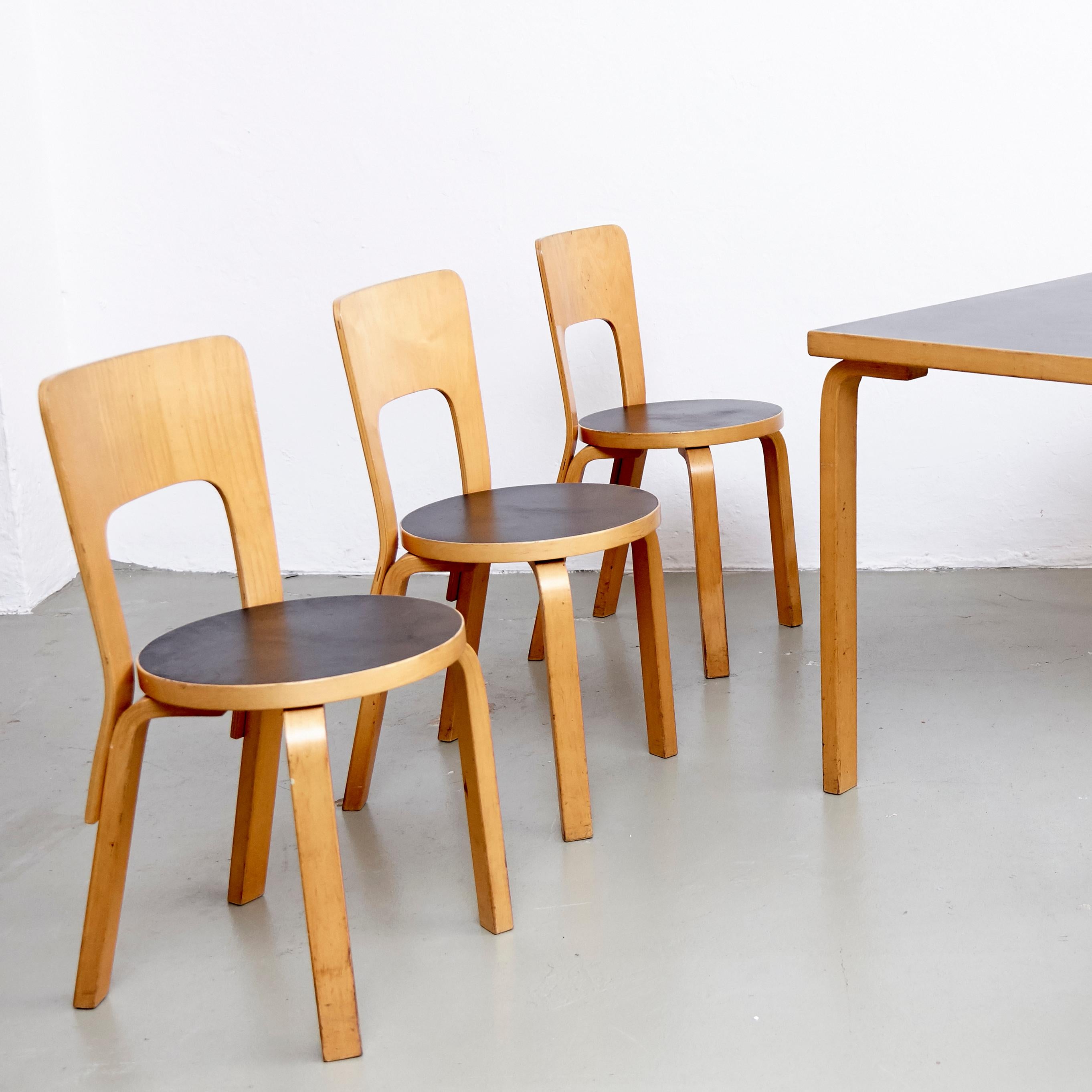 Dining table and chairs designed by Alvar Aalto, 

Measures: Table 75 cm D x 121 cm W x 71 cm H
Chair 44 cm D x 39 cm W x 77 cm H

In good original condition, with minor wear consistent with age and use, preserving a beautiful patina with some