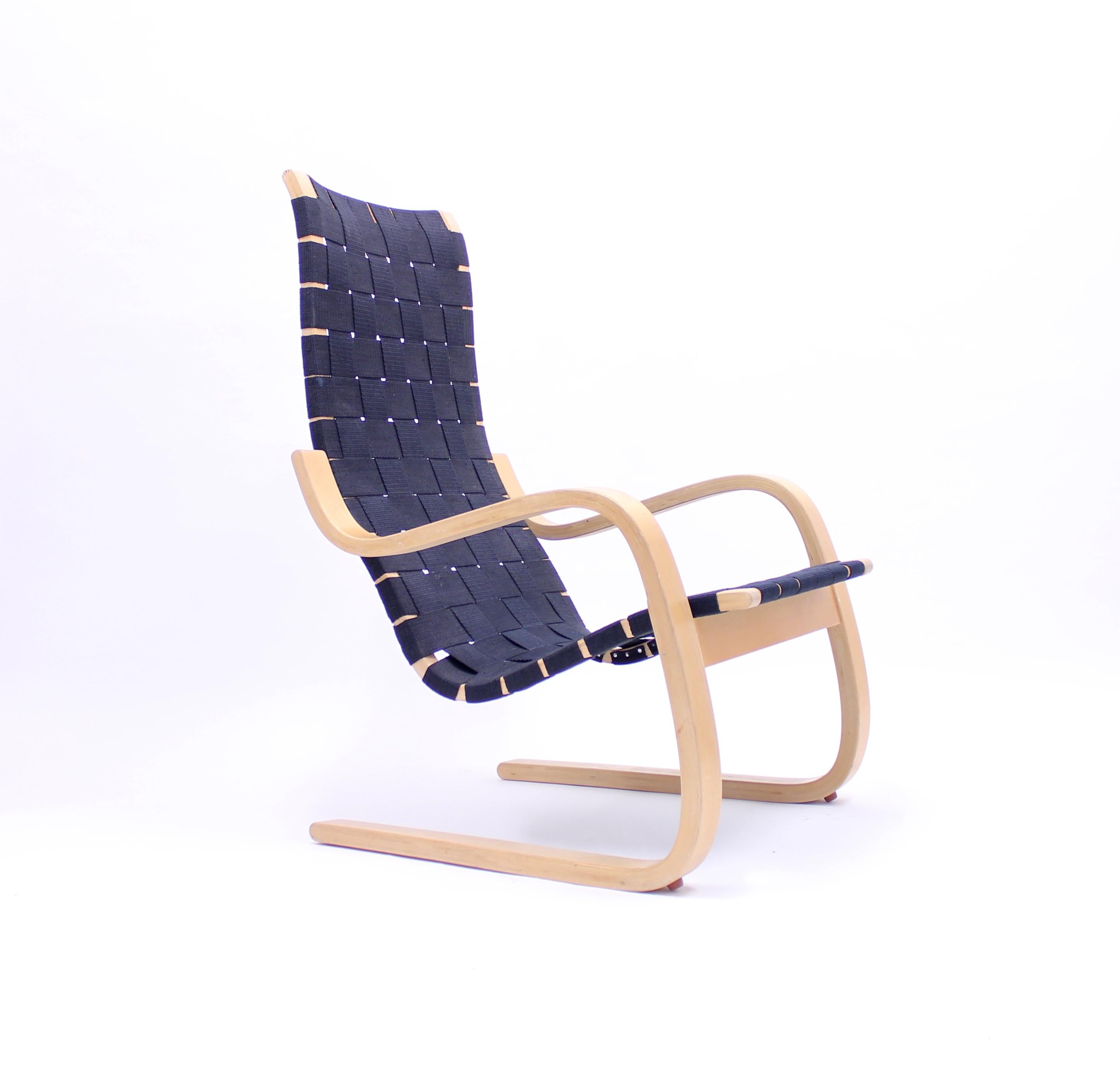 Early production, model 406 easy chair, by Alvar Aalto for Artek, Hedemora, circa 1950. Frame of steam bent birch and later upholstery in hemp webbing commissioned by the original owner. It has a very special provenance. This single owner example