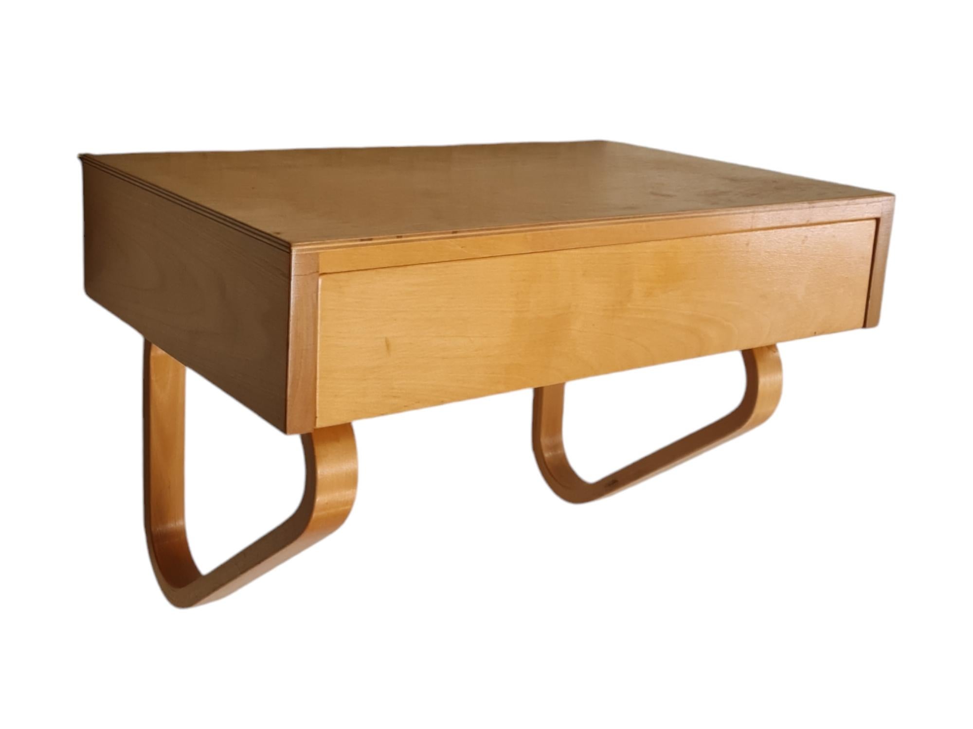 A beautiful entryway set of a drawer console, mirror and stool by Alvar Aalto for Artek made of solid birch. The set is in original condition with a light surface finishing. The wood has the highly sought-after and beautiful 