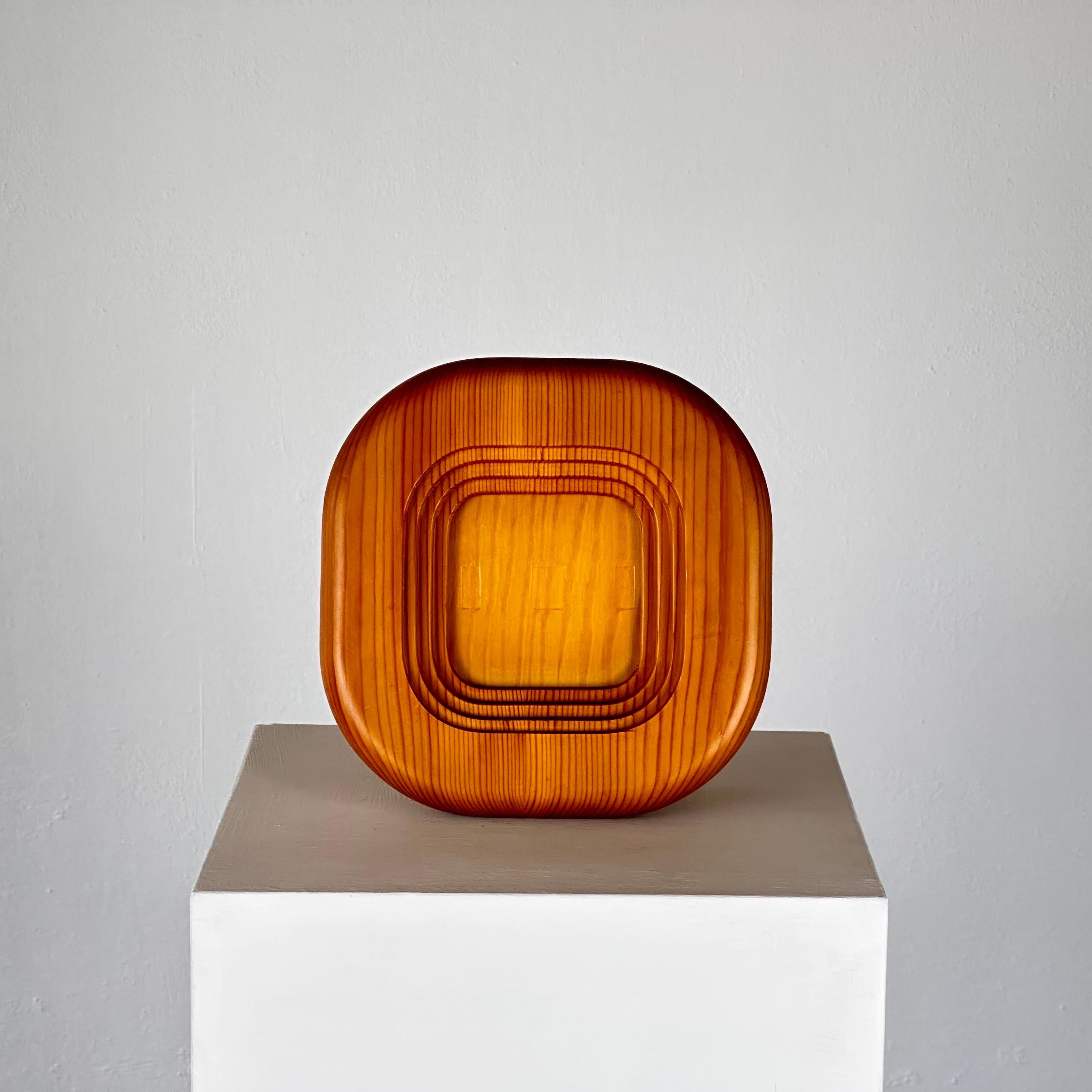 Presenting a timeless piece of mid-century design, this vintage Pine Wood Photo Frame by renowned Finnish architect and designer Alvar Aalto for Artek captures the essence of Scandinavian craftsmanship from the 1970s. Aalto, celebrated for his