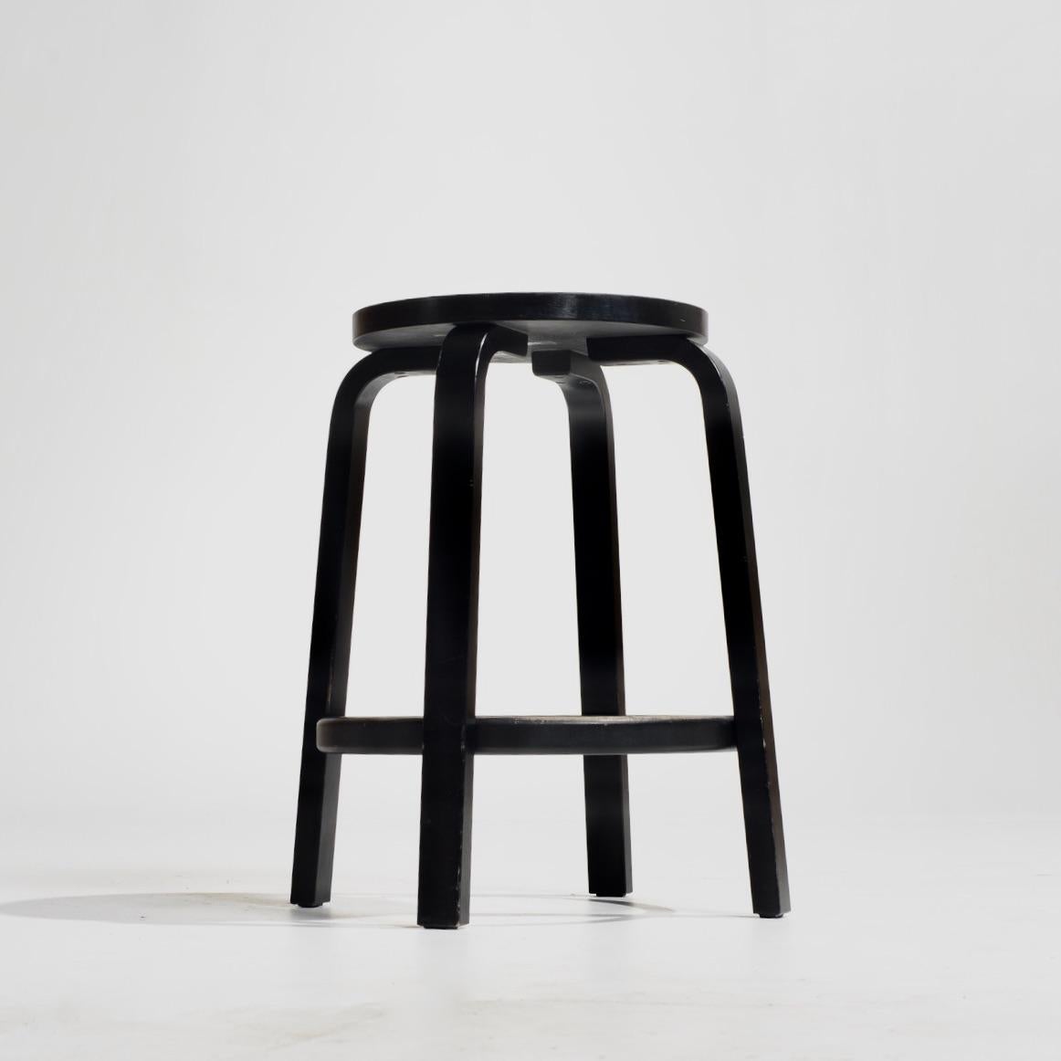 Iconic Alvar Aalto four legged stool made with bending chair legs of solid wood. This method of bending was conceived by joiner Otto Korhonen. Legs are mounted onto to the underside of the round seat with no additional connecting elements. With its