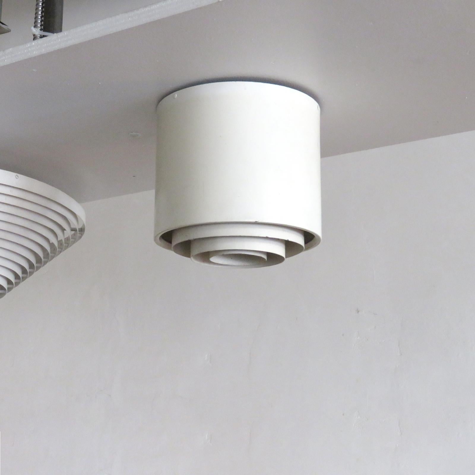 Wonderful flushmount ceiling light by Alvar Aalto for Idman Oy, Finland, in enameled metal with louvered diffuser, one E26 socket, max. wattage 75w each or LED equivalent, wired for US standards or European standards (110v/220v), UL listing