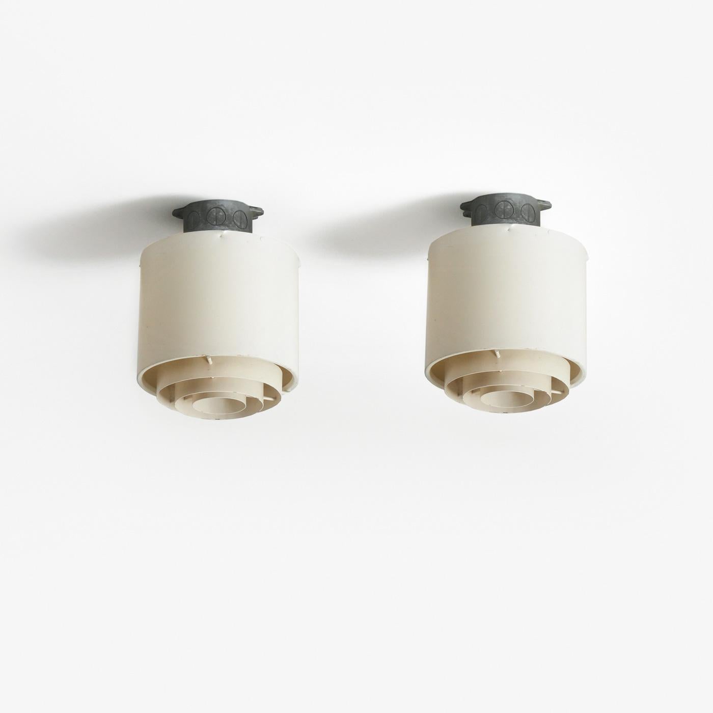 Pair of metal ceiling lamps designed by Alvar Aalto for Idman in Finland, 1950s.

The lamps feature the original manufacturer’s stamp.

Date of manufacture: 1950s
Origin: Finland
Material: Metal
Dimensions (each): H 25 cm x diameter 19 cm
Condition:
