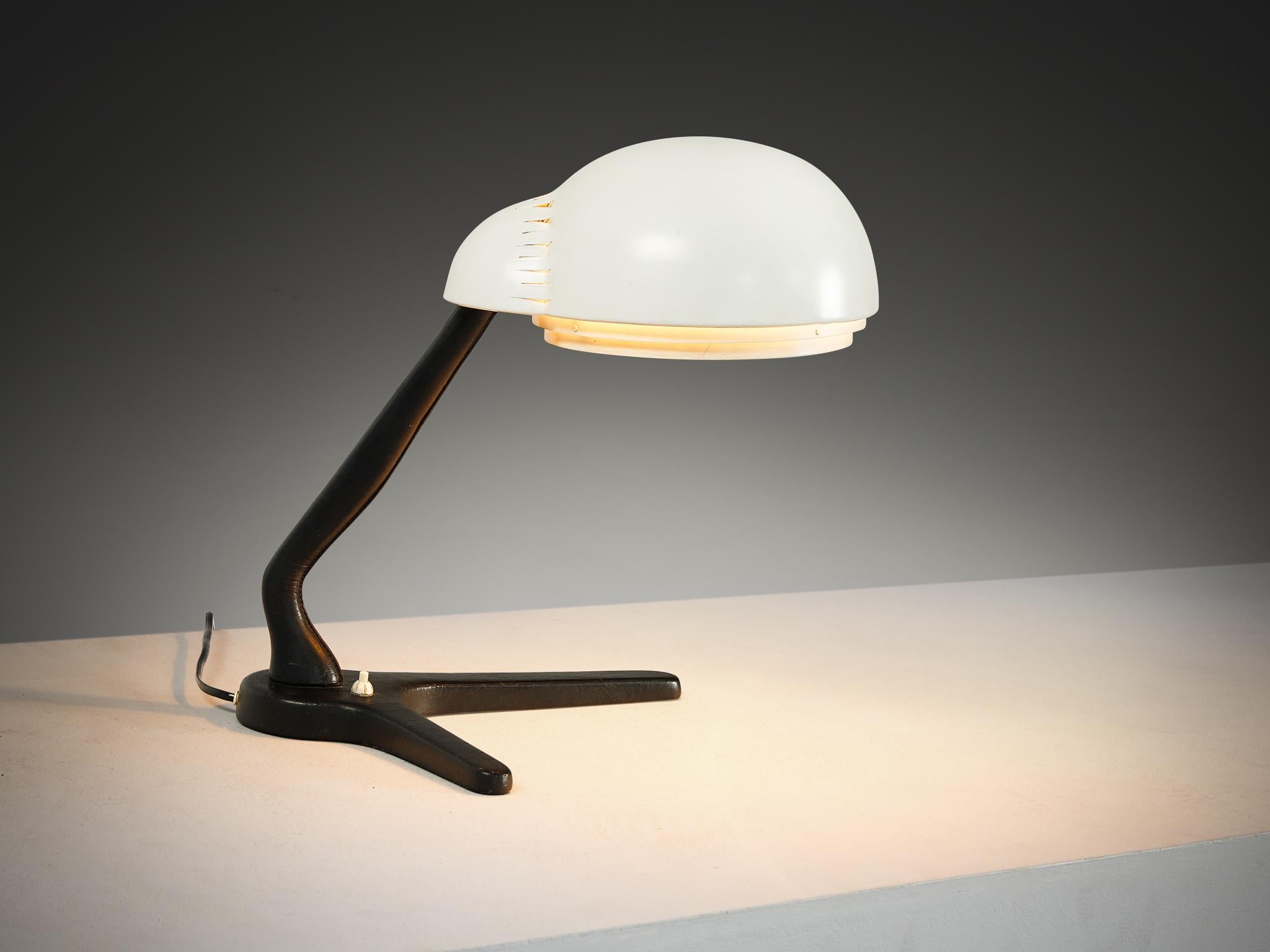 Alvar Aalto for Valaistustyö Ky, desk lamp, model ‘A704’, enameled steel, enameled aluminum, leather-bound metal, Finland, 1954 
 
This table lamp model ‘A704’ is designed by Finnish modernist architect and industrial designer Alvar Aalto for