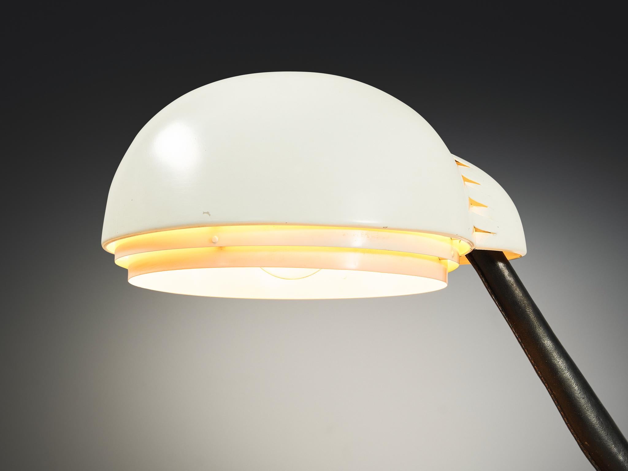 Alvar Aalto for Valaistustyö Ky, desk lamp, model ‘A704’, enameled steel, enameled aluminum, leather-bound metal, Finland, 1954 
 
This table lamp model ‘A704’ is designed by Finnish modernist architect and industrial designer Alvar Aalto for