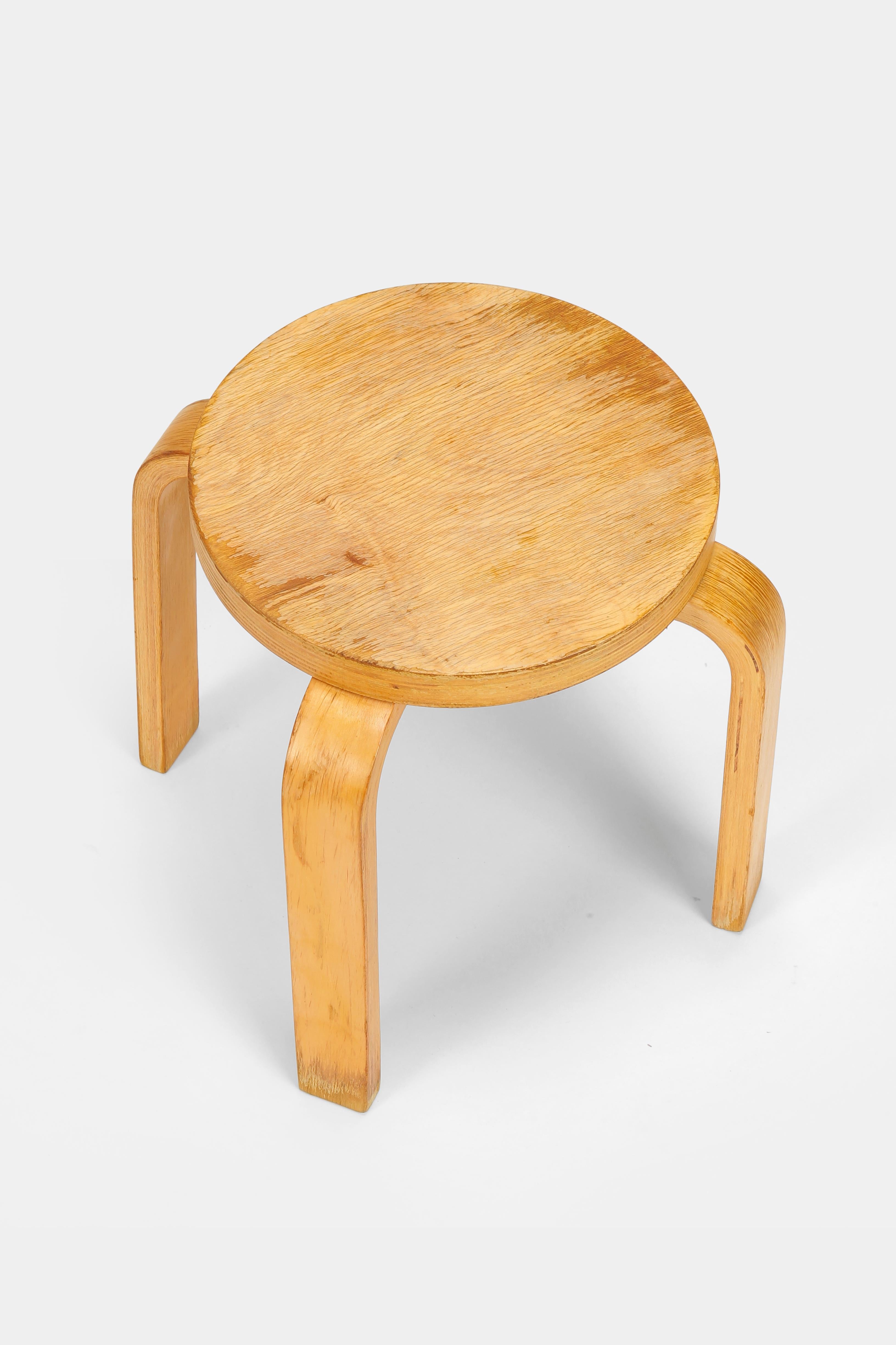 Alvar Aalto children's stool made of birch plywood by Artek in Finland in the eighties. Iconic Finnish design and material. Lightly restored and in used condition.