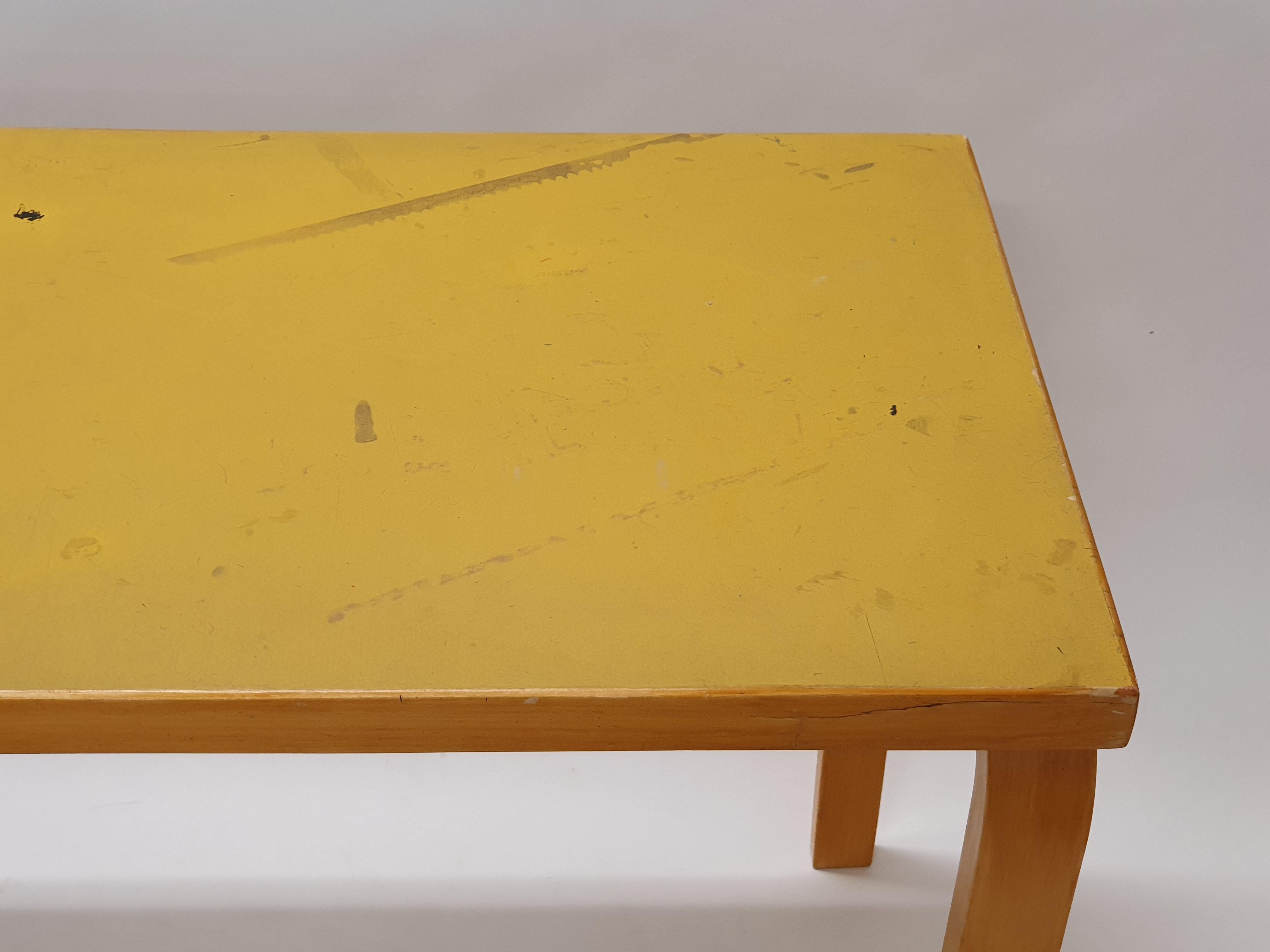 Artek table, birch with yellow linoleum. Designed by Alvar Aalto. The table is from the 1960s and shows nicely signs of life.