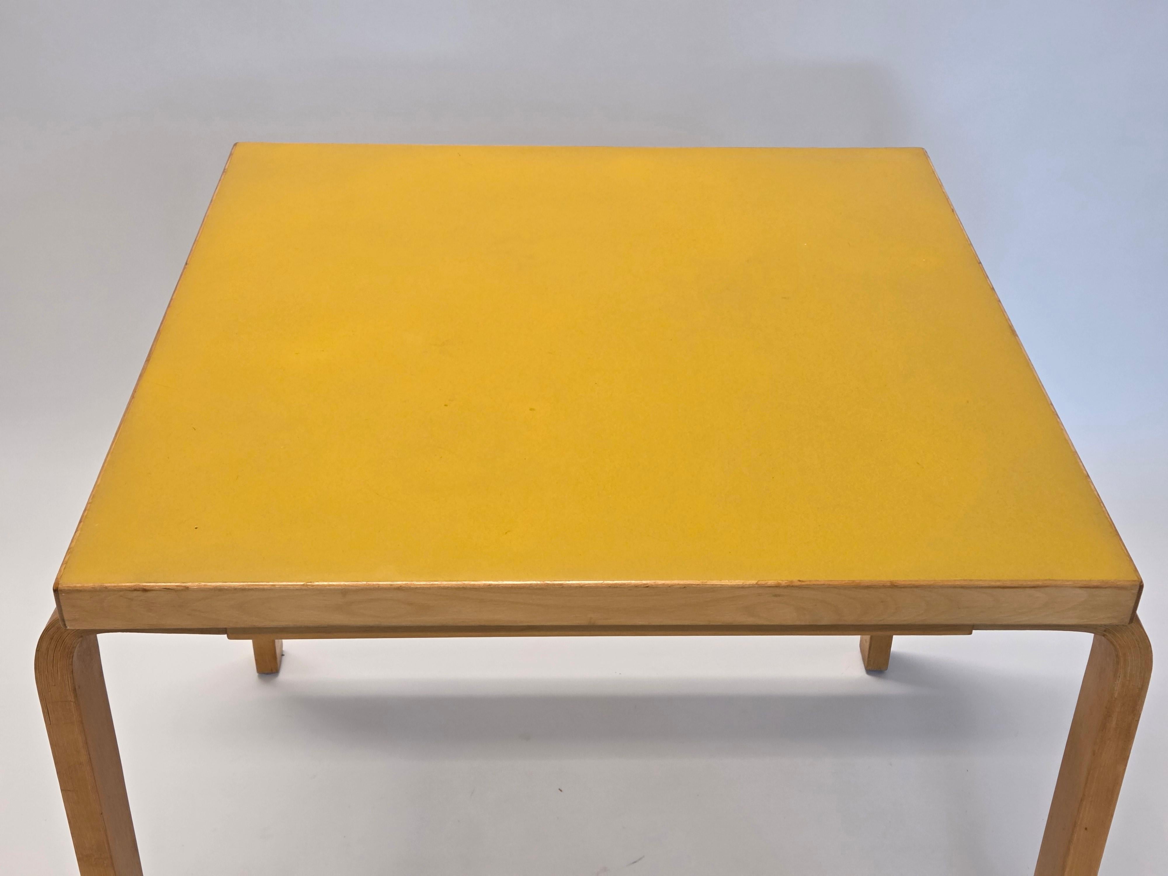 Artek table, model 81C, birch with yellow linoleum. The table is from the 1960s and in good condition.