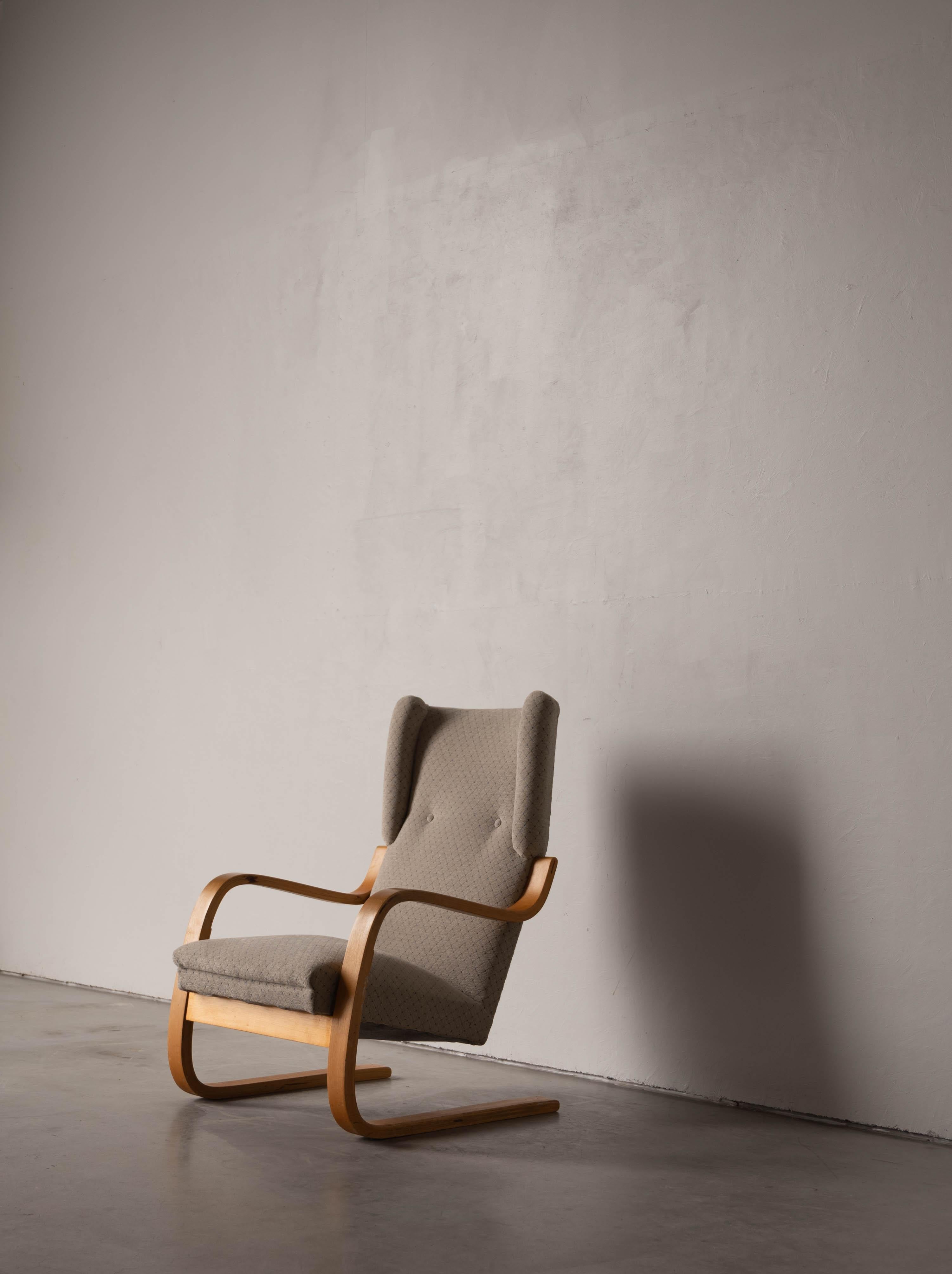 A birch and fabric lounge chair designed by Alvar Aalto and produced by Artek, Finland, c. 1970s.