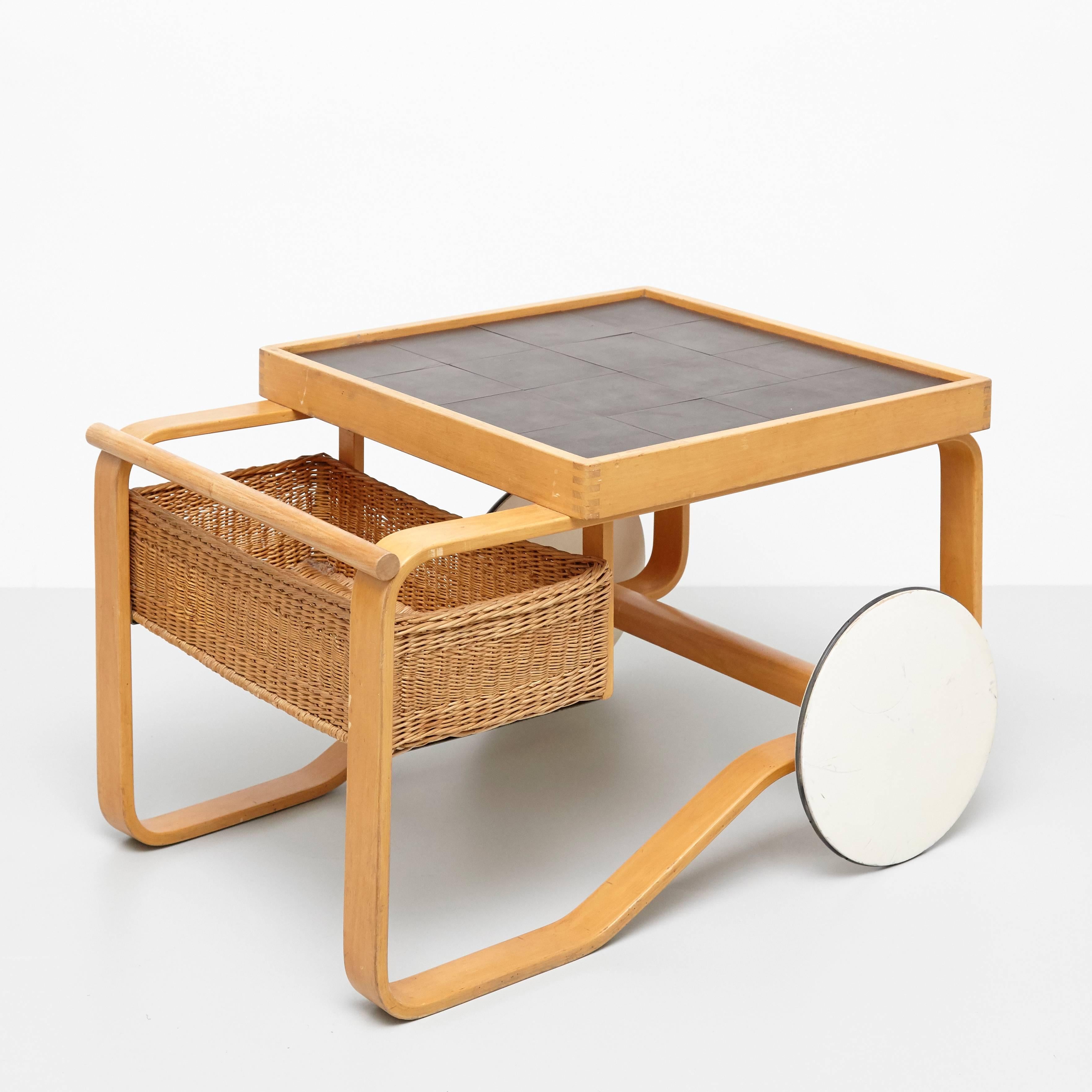 Tea trolley model 900, designed by Alvar Aalto for Artek, Finland, 1935. 

Birch, ceramic tiles and cane.

Measures: 64 x 91 x 59 cm

In great original condition, with minor wear consistent with age and use, preserving a beautiful patina.
