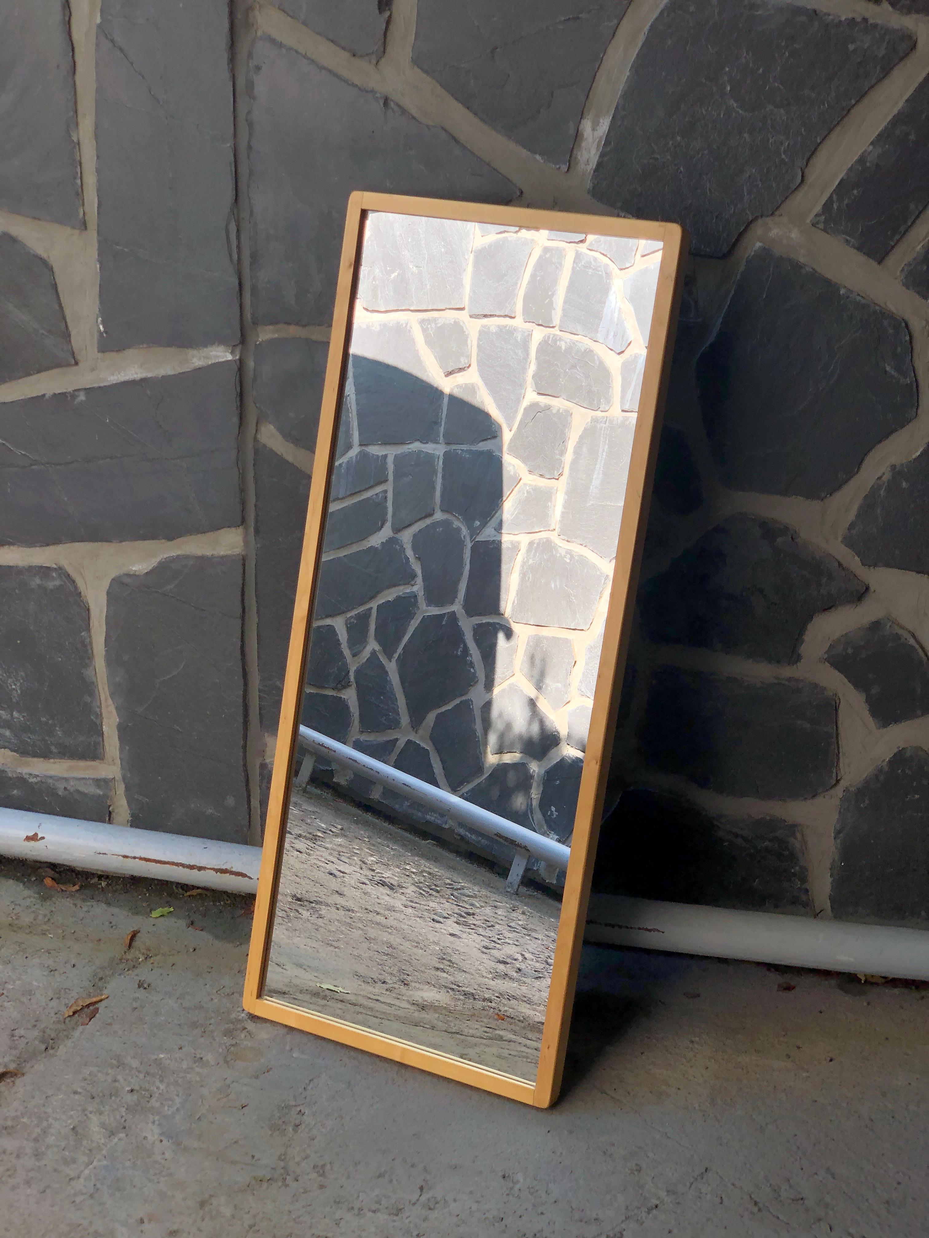 Iconic mirror designed by Alvar Aalto and manufactured by Artek in Finland. 

This mirror makes a great addition to any space, be it a bedroom,  office table, or an entrance. So simple yet so good looking and practical. It's in great orginal