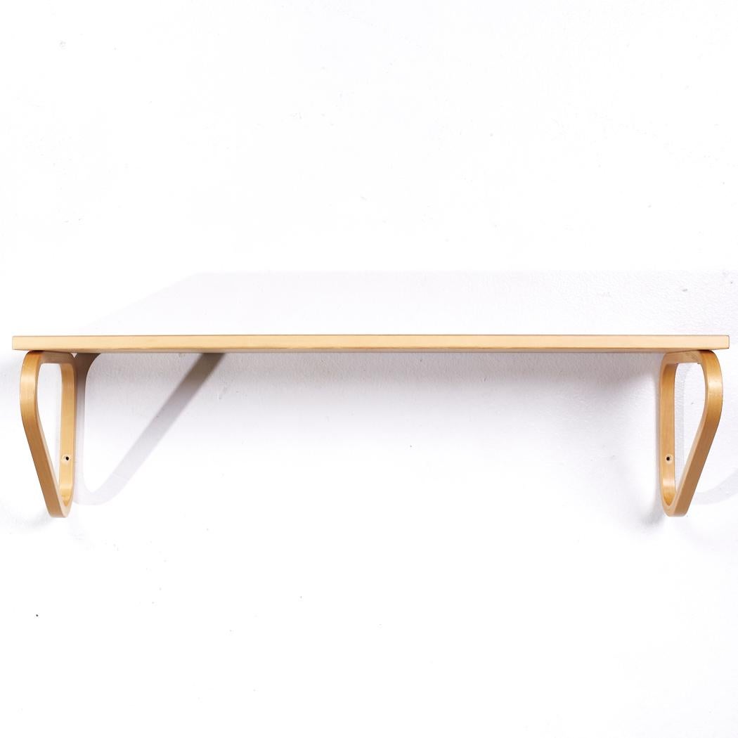 Alvar Aalto Model 112b Mid Century Finnish Birch Wall Mount Shelf

This shelf measures: 35.5 wide x 10.75 deep x 9.75 inches high

All pieces of furniture can be had in what we call restored vintage condition. That means the piece is restored upon