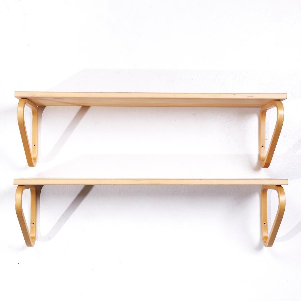 Alvar Aalto Model 112b Mid Century Finnish Birch Wall Mount Shelf - Pair

Each shelf measures: 35.5 wide x 10.75 deep x 9.75 inches high

All pieces of furniture can be had in what we call restored vintage condition. That means the piece is restored