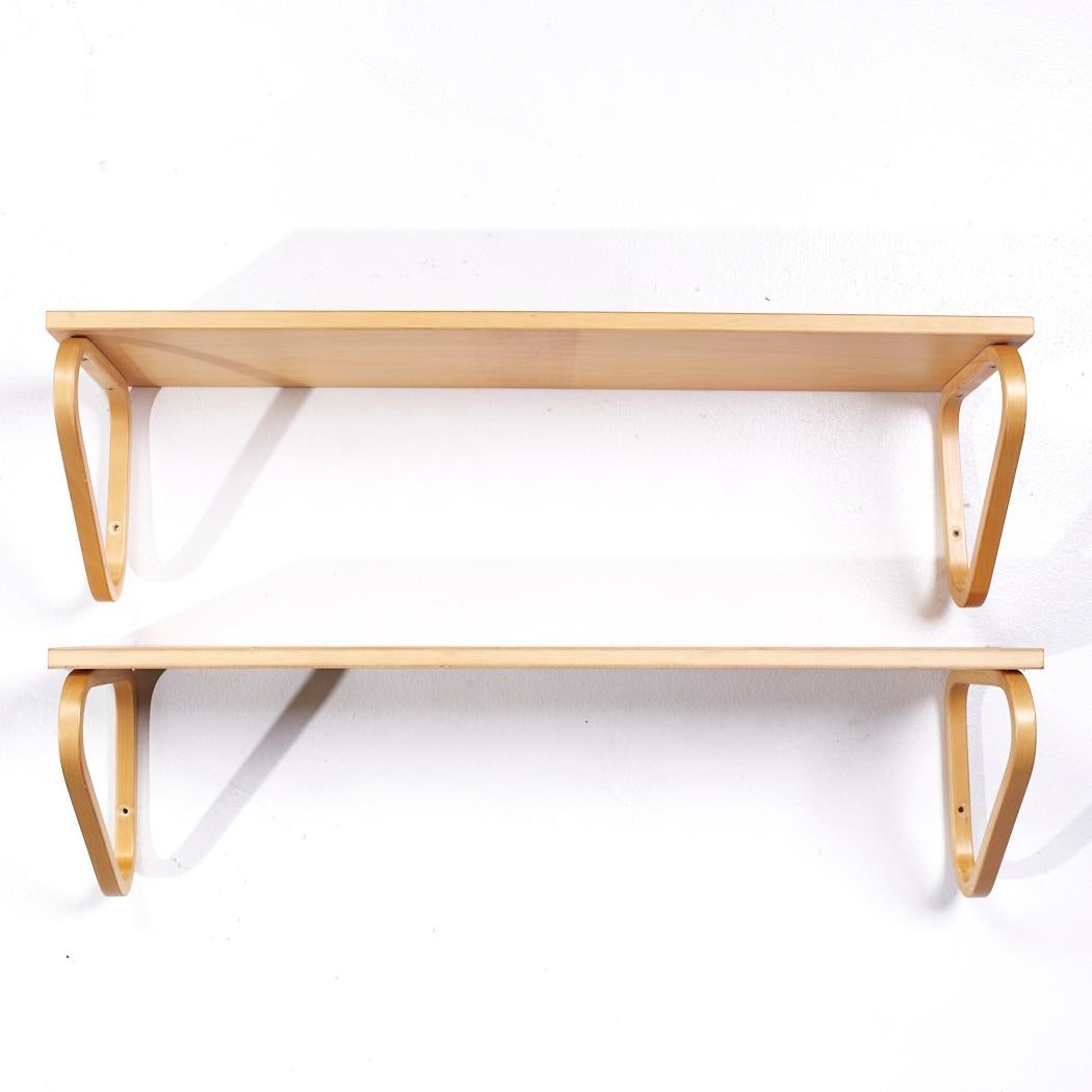 Alvar Aalto Model 112b Mid Century Finnish Birch Wall Mount Shelf - Pair

Each shelf measures: 35.5 wide x 10.75 deep x 9.75 inches high

All pieces of furniture can be had in what we call restored vintage condition. That means the piece is restored