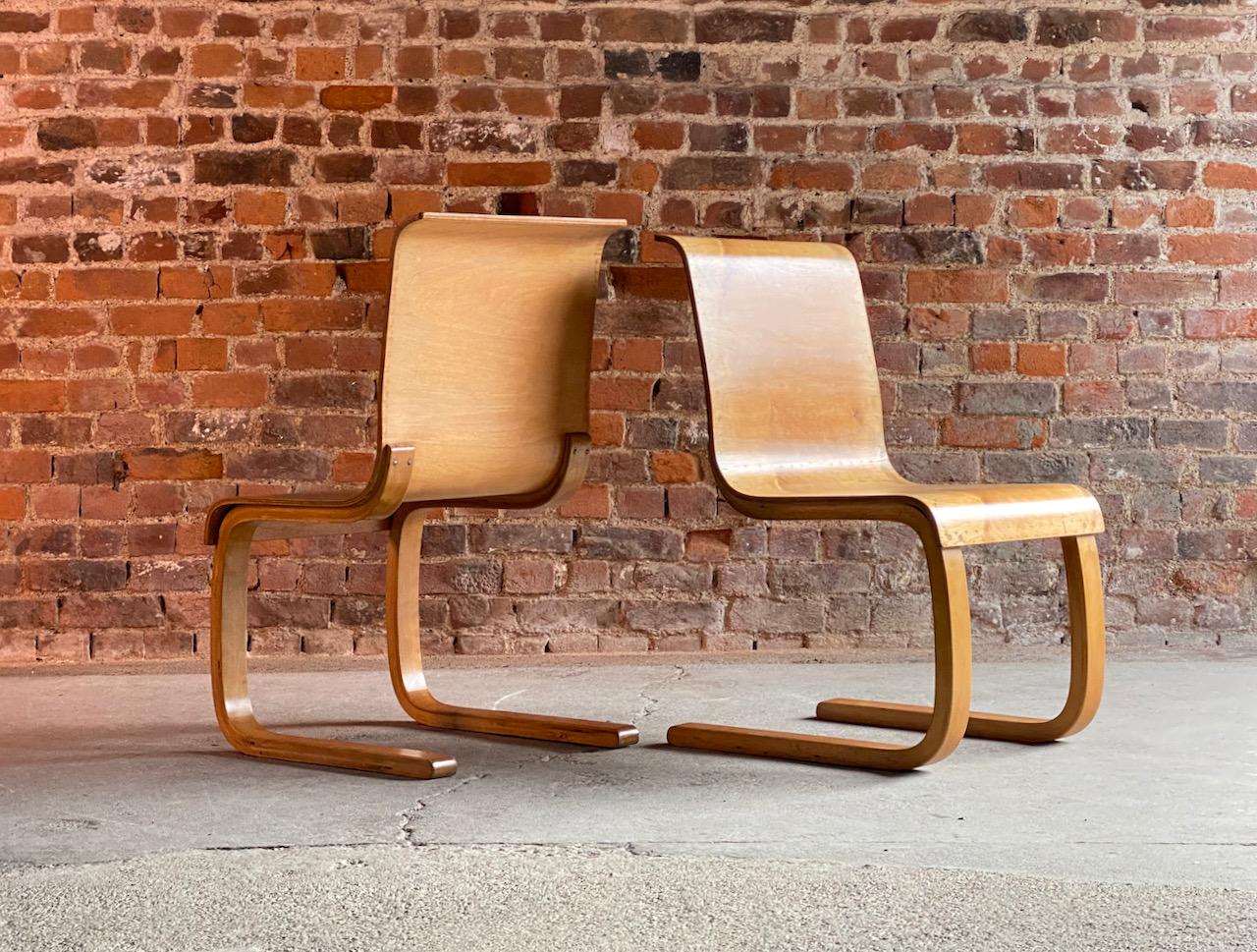 Alvar Aalto model 21 cantilever side chairs by Finmar, pair, Finland, circa 1935

Pair of Alvar Aalto model 21 cantilever side chairs for Finmar, Finland, circa 1935, bent laminated birch frame with moulded plywood seat, the chairs have a faded