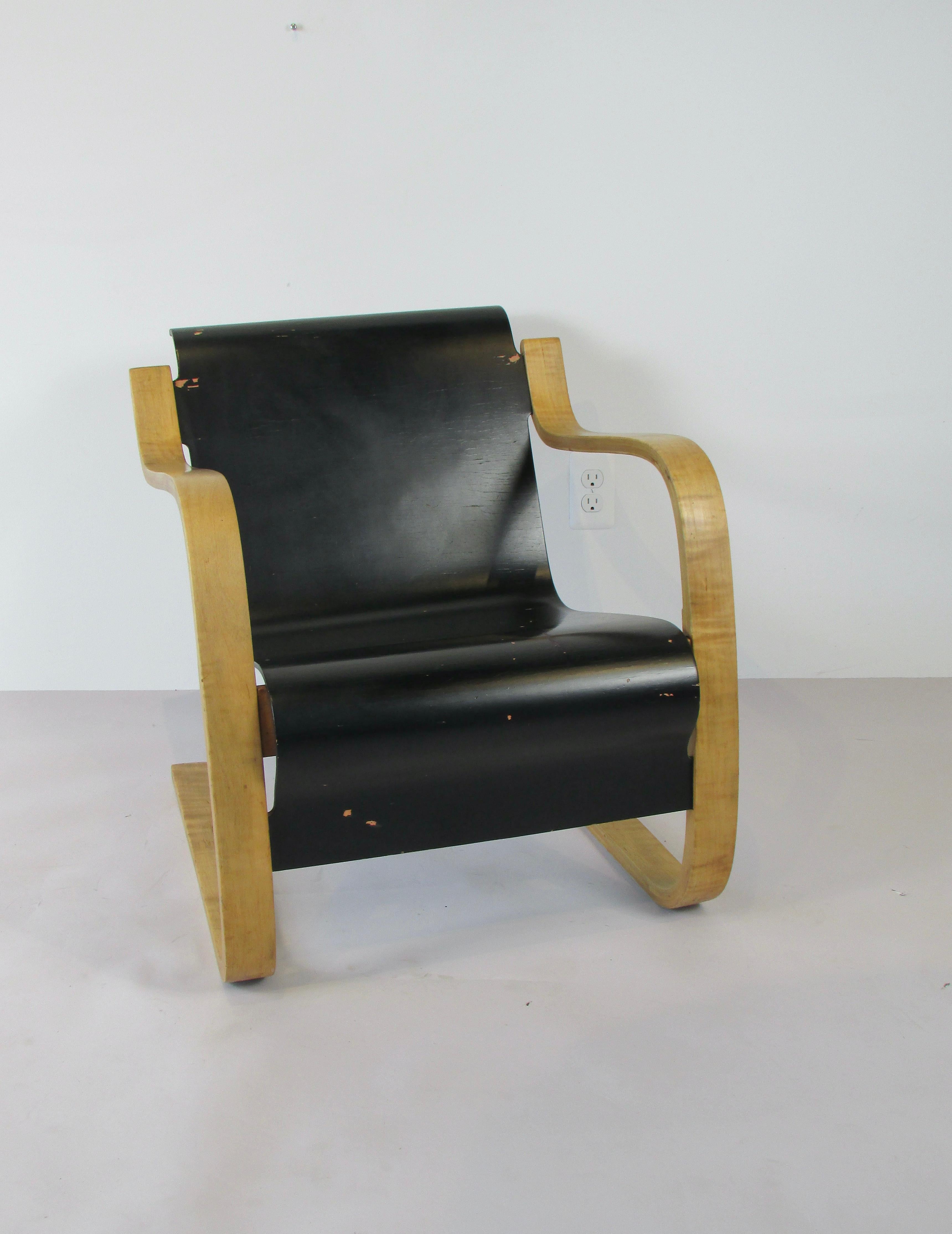I believe this to be an early production chair in original somewhat worn finish. One of several designed by the Finnish architect Alvar Aalto during time he was building a tuberculosis sanitarium at Paimio, Finland. Cantilever design a principle