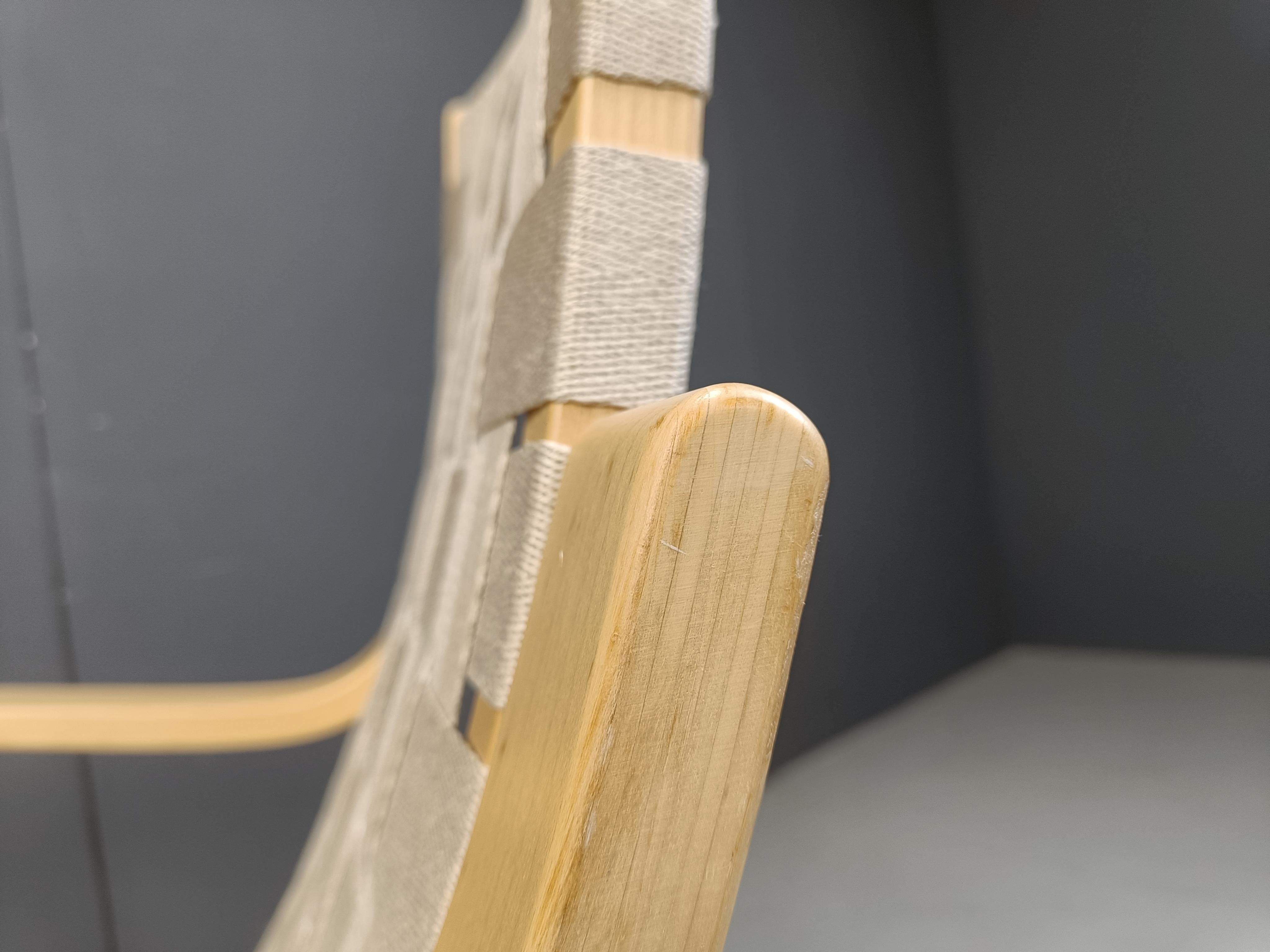 Gorgeous and elegant cantilever design armchairs designed by Alvar Aalto in 1939 and produced until today by Artek.

This armchair consists of a cantilevered birchwood frame, thats made out of a single piece of wood for durability reasons and fabric