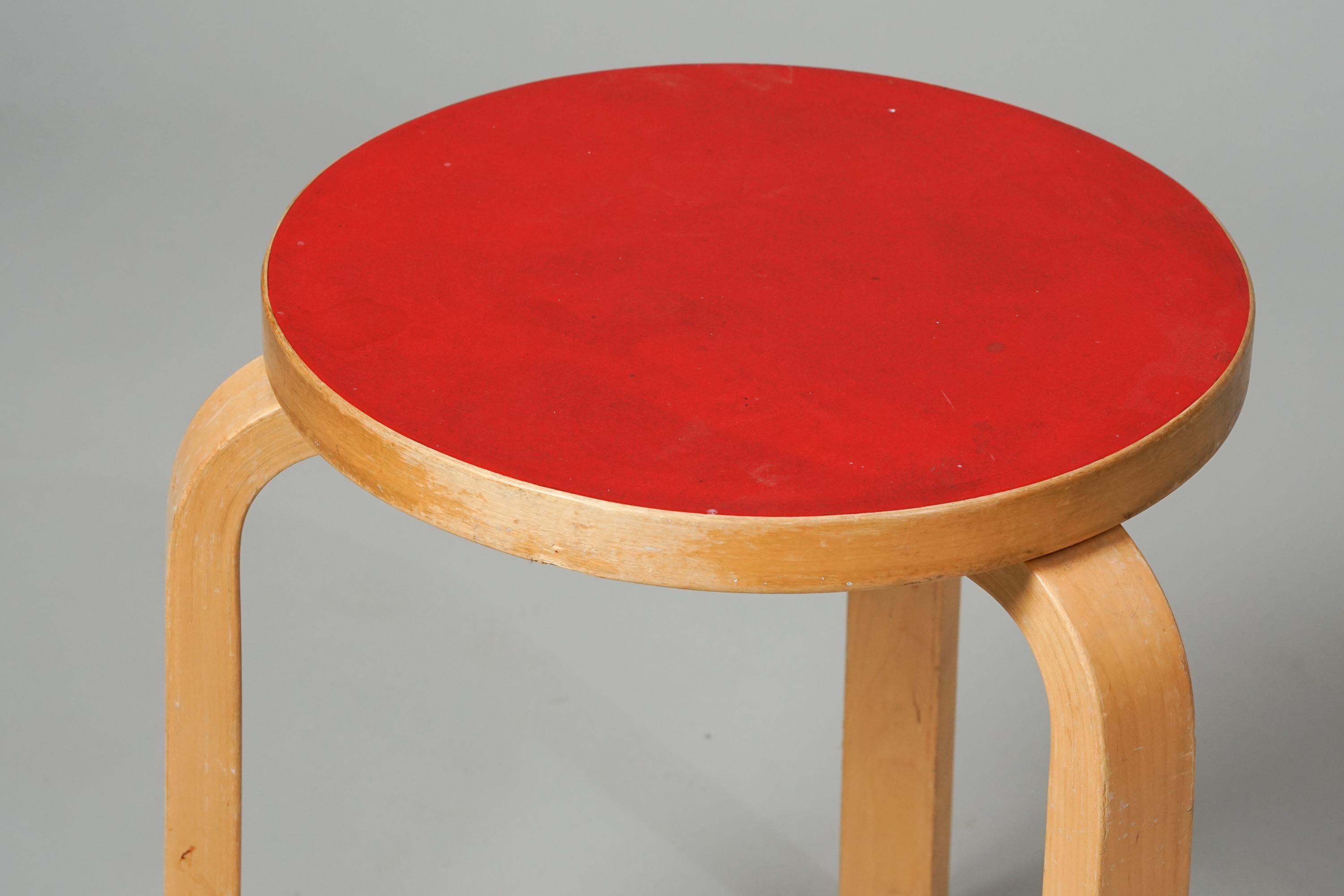 Model 60 Stool by Alvar Aalto for Artek from the 1960s. Birch frame with linoleum top. Good vintage condition, beautiful patina and wear consistent with age and use. Classic Alvar Aalto design.
