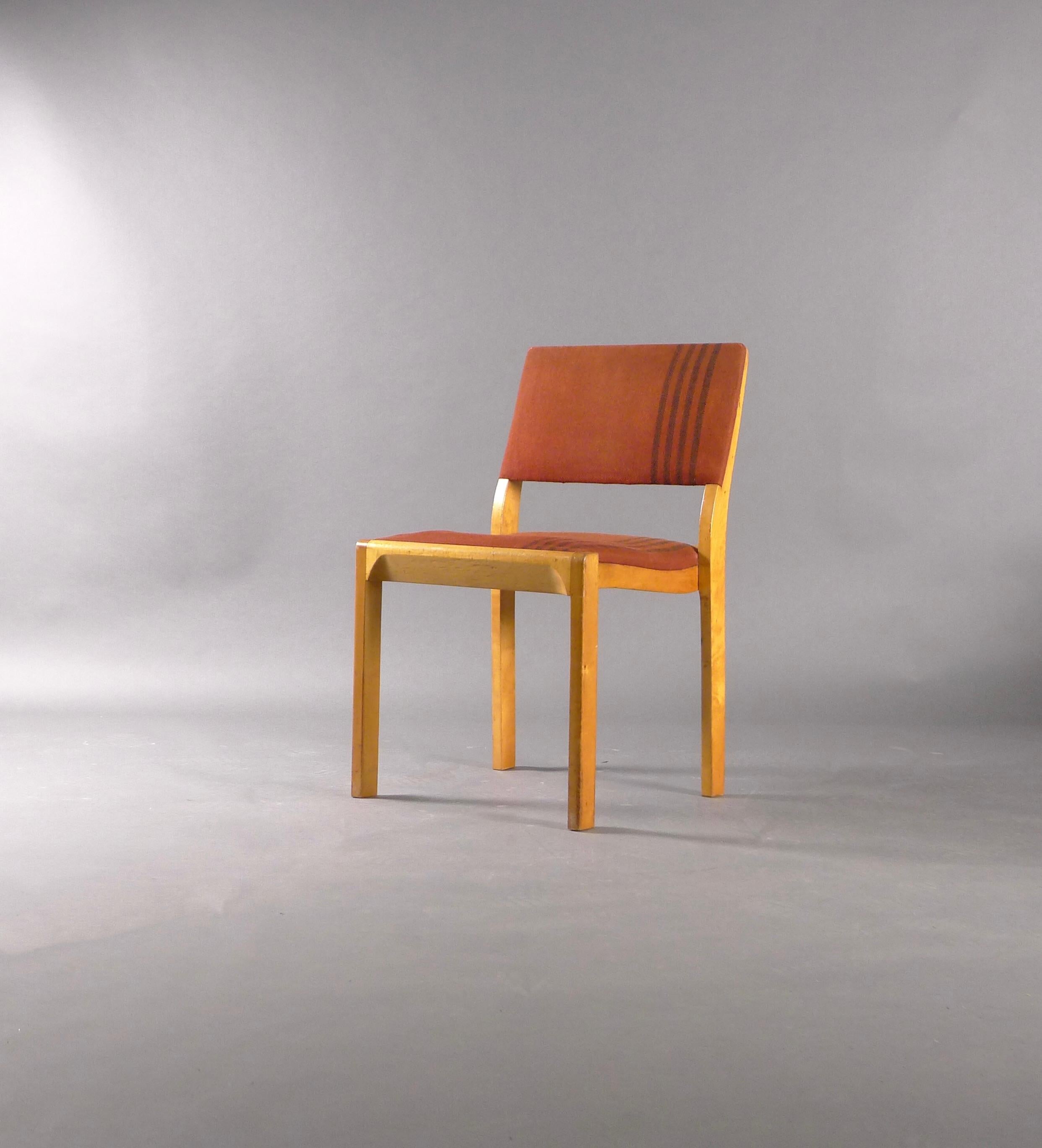 Model 611 birch stacking chair, designed in 1929 by Alvar Aalto and made by Finmar, Finland.  This is an extremely rare variant with original red fabric, the design believed to be the work of Aalto's wife Aino.  An early production example with