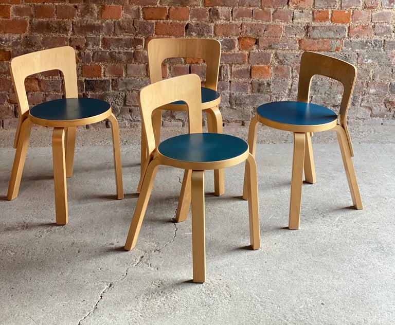 Alvar Aalto Model 65 dining chairs by Artek Finland circa 1950s

Midcentury Scandinavian design Alvar Aalto Model 65 dining chairs by Artek Finland circa 1950s, set of four laminated birch chairs with moulded plywood back rests screwed to rear