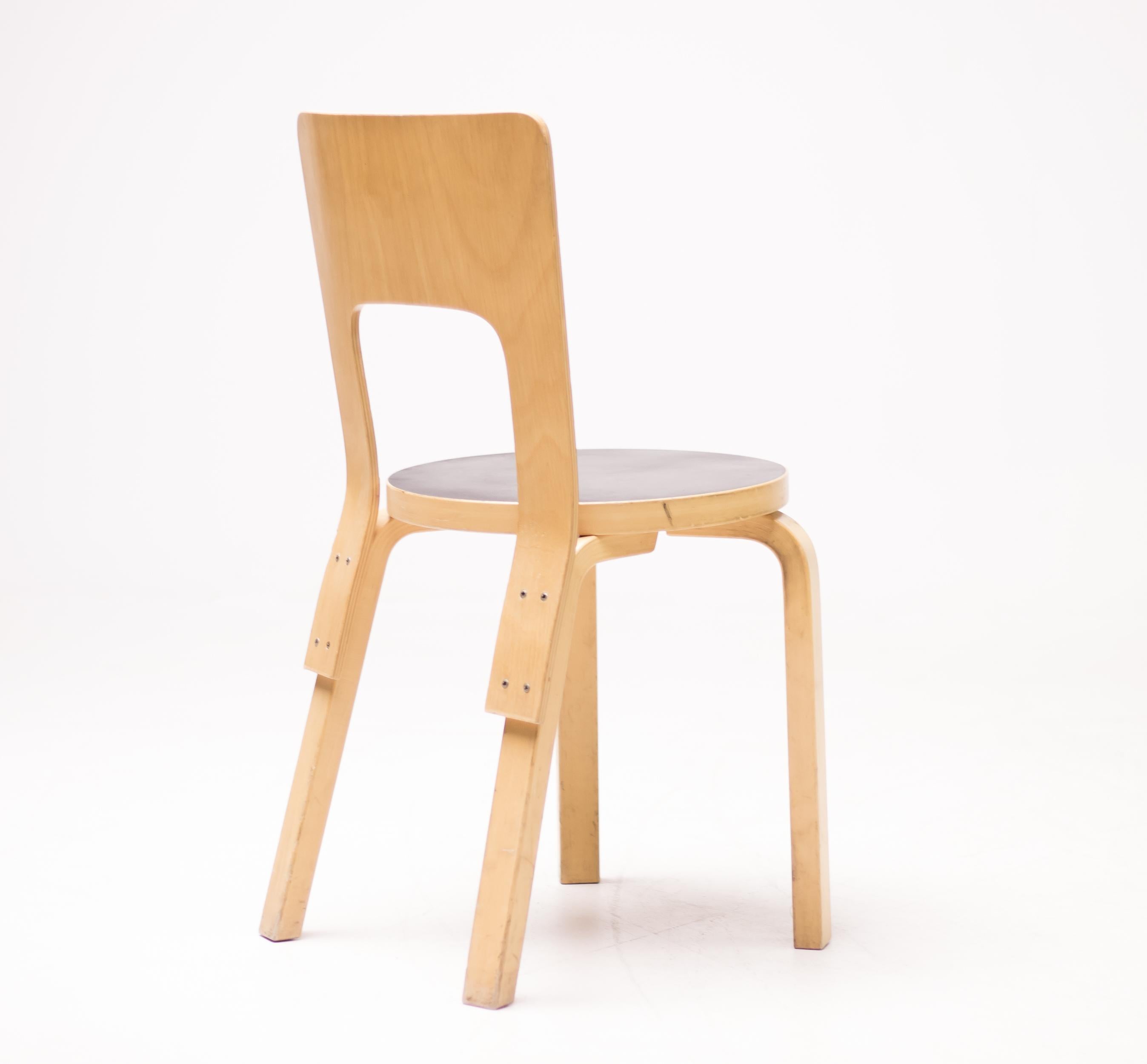 Alvar Aalto model 66 dining chairs manufactured by Artek, Finland.
Birch plywood with black linoleum seat. 
Made in 1980-2007, some marked with Artek label.
Priced individually, circa 45 pieces available.