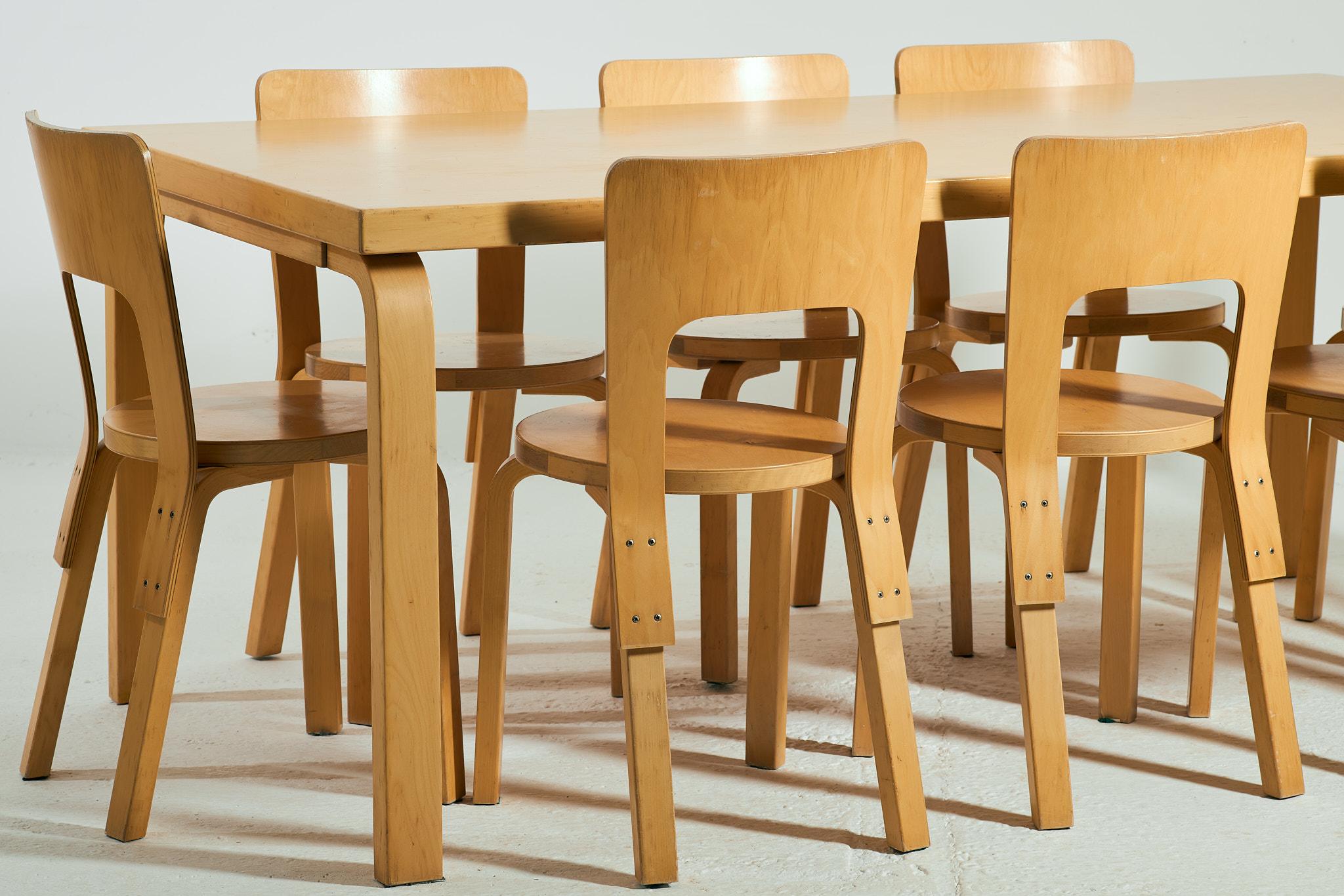 A vintage model 83 dining table by Alvar Aalto for Artek made of Finnish Birch ply & 8 model 66 chairs in the same wood. 

This set is over 20 years old but the exact production date is unclear. There are no stamps or marks related to Artek but the