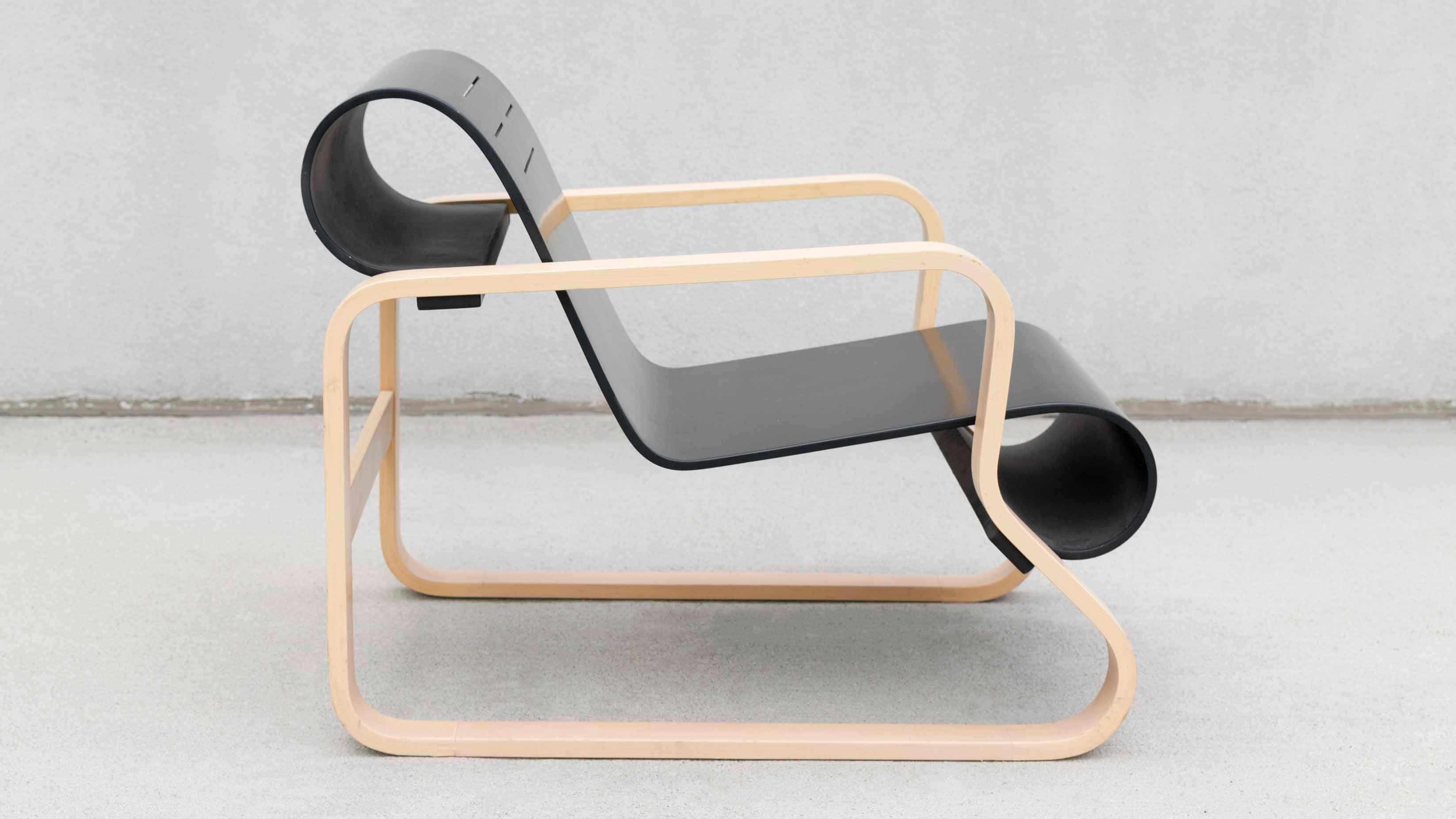 The Paimio “Chair 41” was originally designed by Alvar Aalto for the Paimio Sanatorium in Southwest Finland in order to help the Tuberculosis patients breathe more easily while sitting. Artek began production of this design in 1931 and still