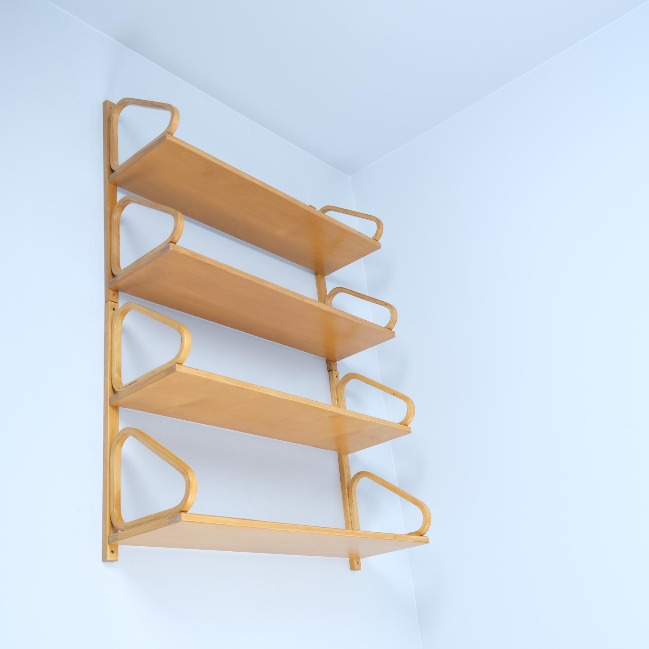 A pair of shelves designed by Alvar Aalto for Artek in the 1930s. They are made from bent laminated birch, solid birch, and plywood birch. If you are looking for one only, we have another listing for a seperate one.
Both are in similar great
