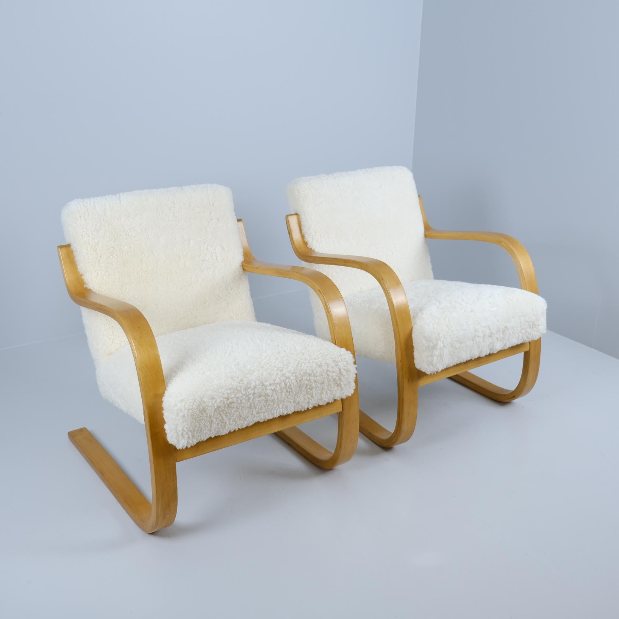 A beautiful pair of mid-century Alvar Aalto cantilever 'spring' chairs model 402, also known as Pikkupaimio (small paimio) associated with the legendary Paimio Sanatorium designed by Aalto. 

The chairs are light-weight and can be situated