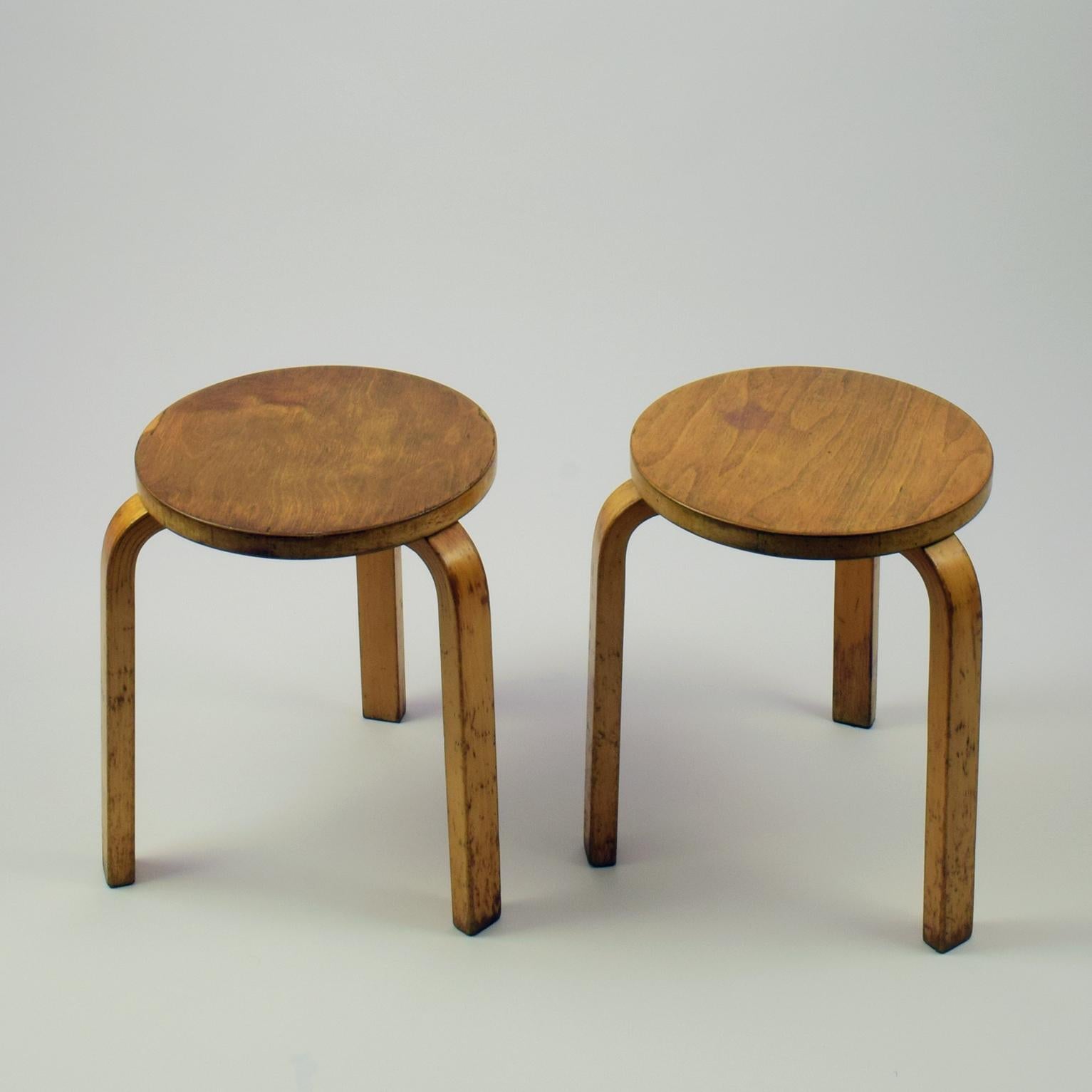 Alvar Aalto
Model 60 stool, designed 1933.
Birch and birch plywood.

These are pre-war or early Postwar production.
Un-restored condition with various marks. One stool has some ply missing from the top, and one stool has a patch of light