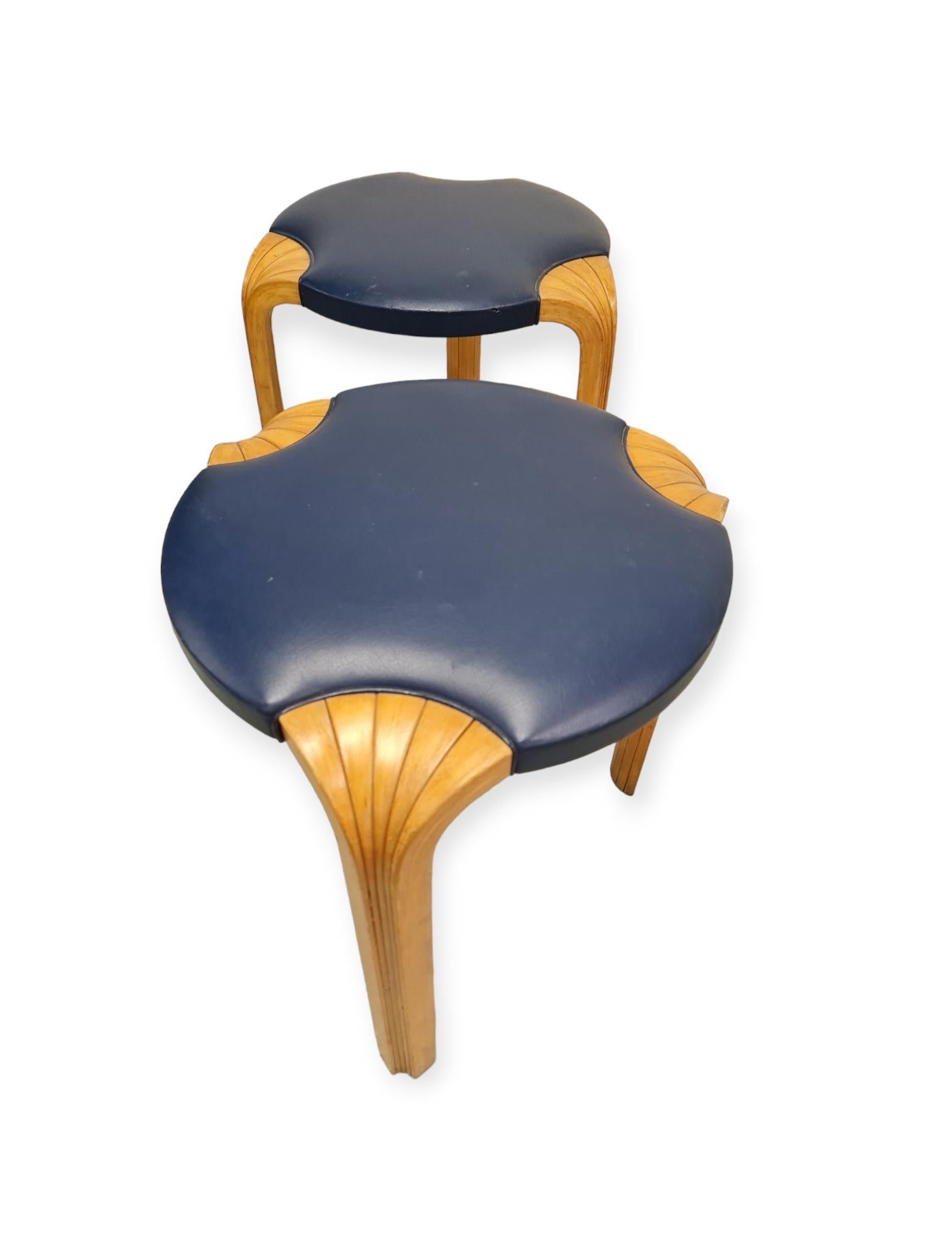 These simple yet elegant stools are of very high quality manufacturing with great attention to detail. The less common x-leg with the original blue leather padding bring plain beauty. The blue color we think is because of the 1952 olympics that were