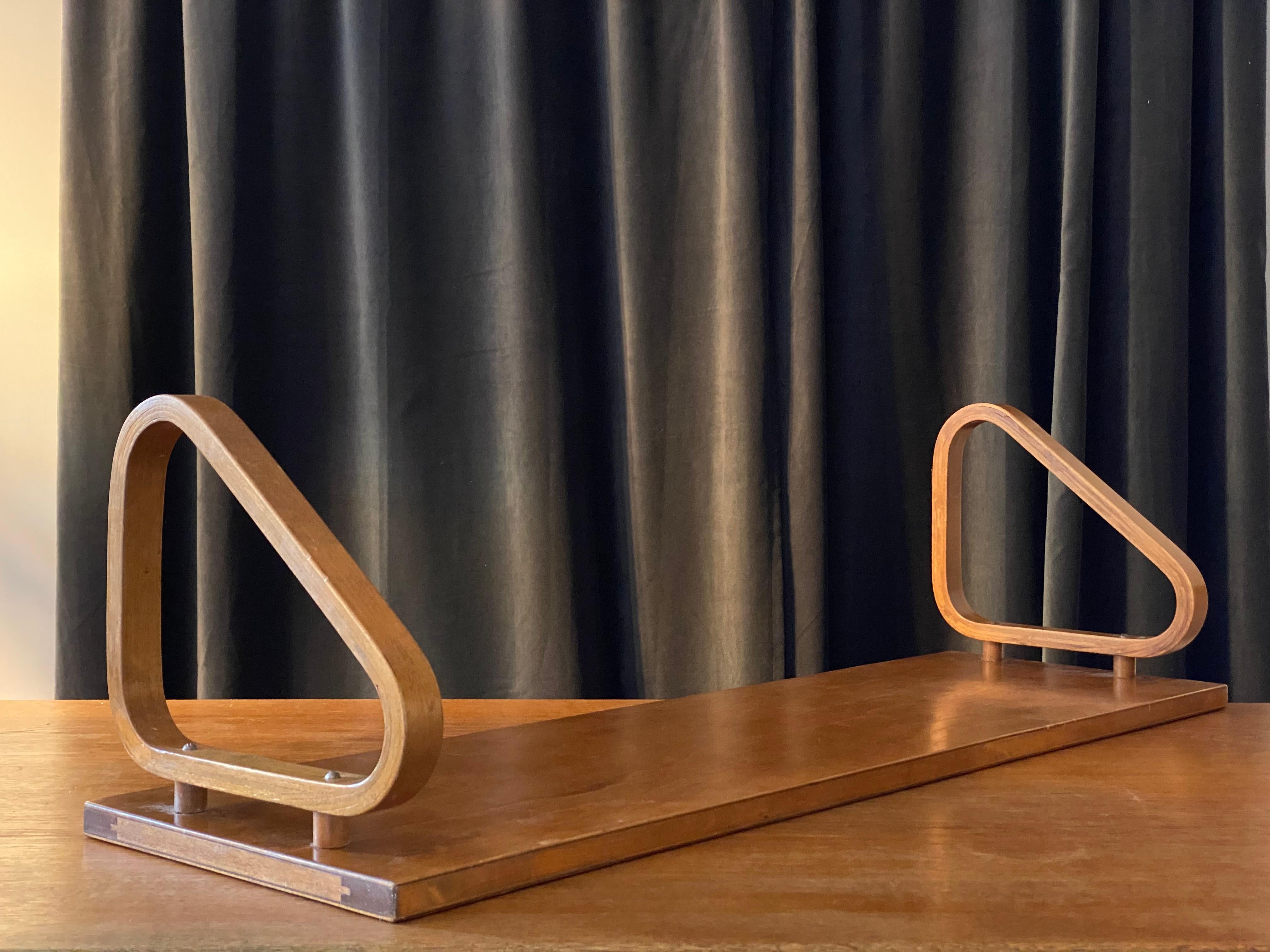 A rare version wall shelf with raised wall mounting, designed by Alvar Aalto. Produced by Artek in the 1950s. Executed in stained birch. 

Other designers of the period include Charlotte Perriand, Pierre Chapo, Josef Frank, Axel Einar Hjorth, and