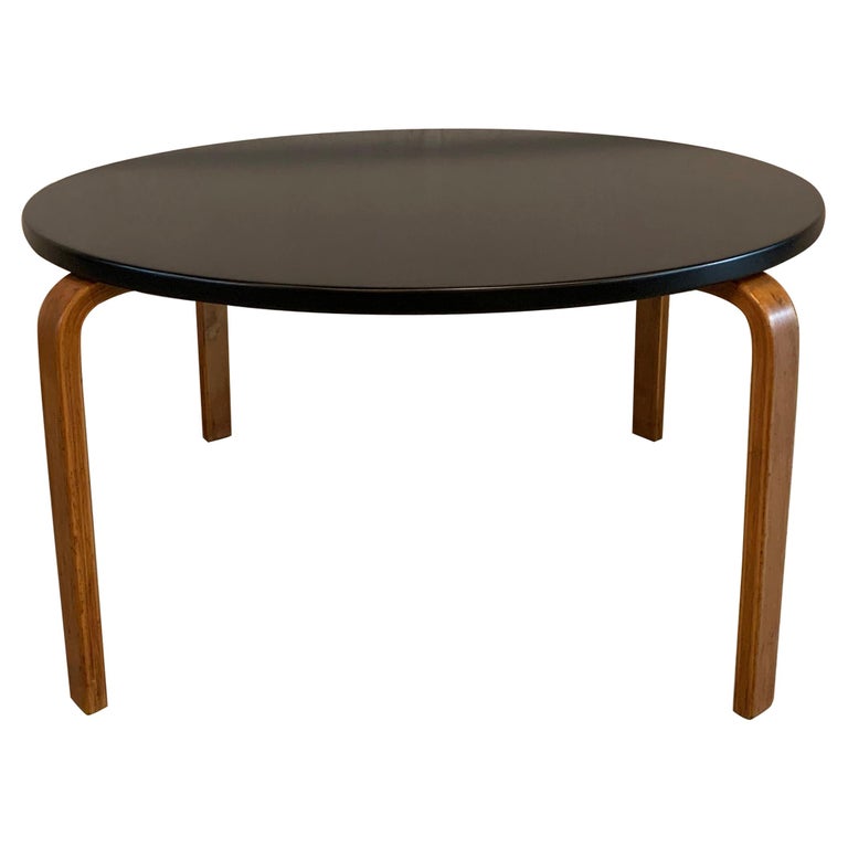 Bent Wood Coffee Table / Bent Wood Coffee Table Phillip Chang : The wooden structure of the table has been designed in a tilt, and vertical brass has been infused to support the structure.