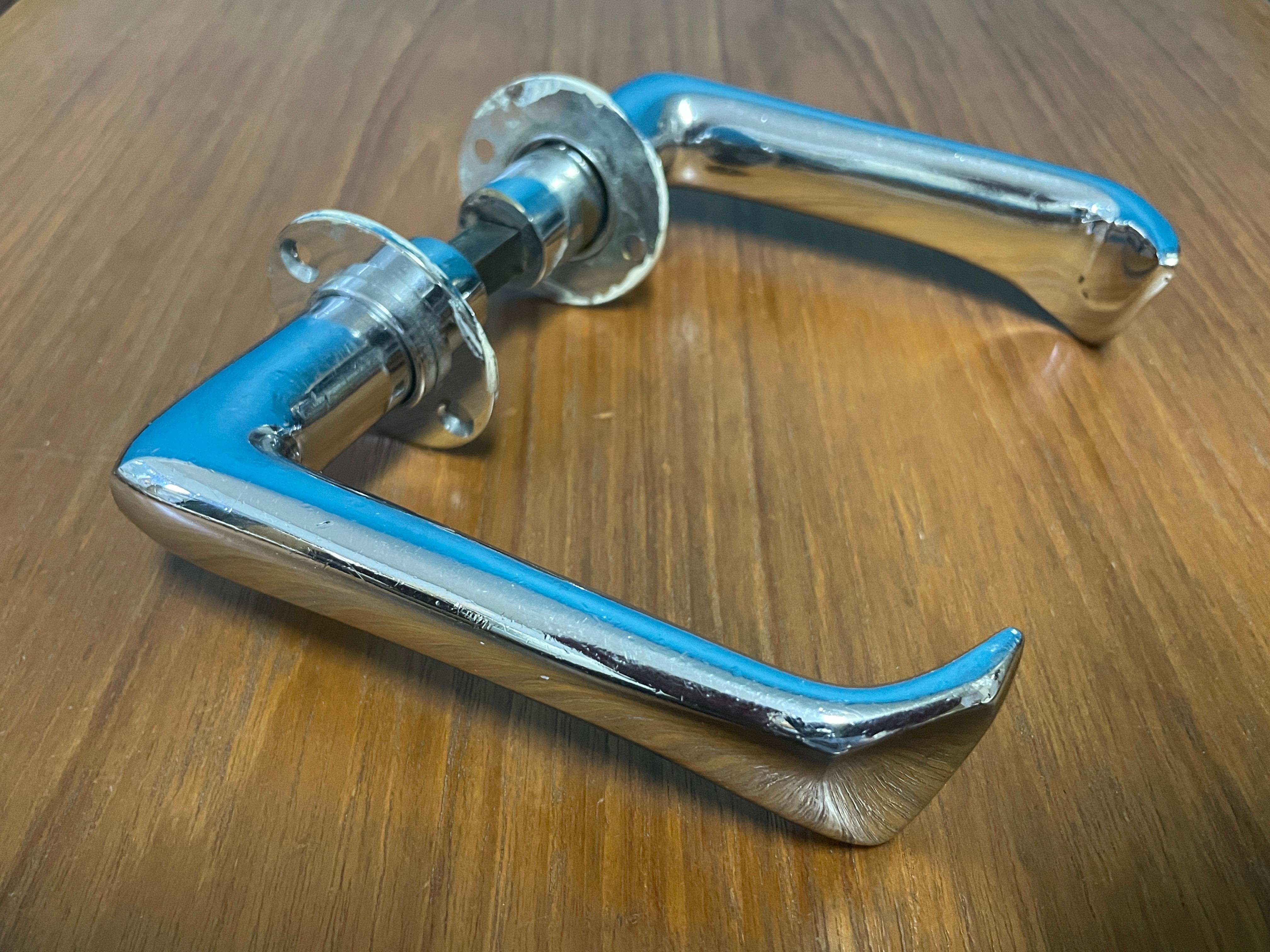 Sculptural Door Handles designed by Alvar Aalto in 1950s. Made in Finland.

Materials: Chrome-plated Brass.

Includes two handles and spacer. No screws.

Rarely for sale. (Most of the same model are newer and made of aluminum.).